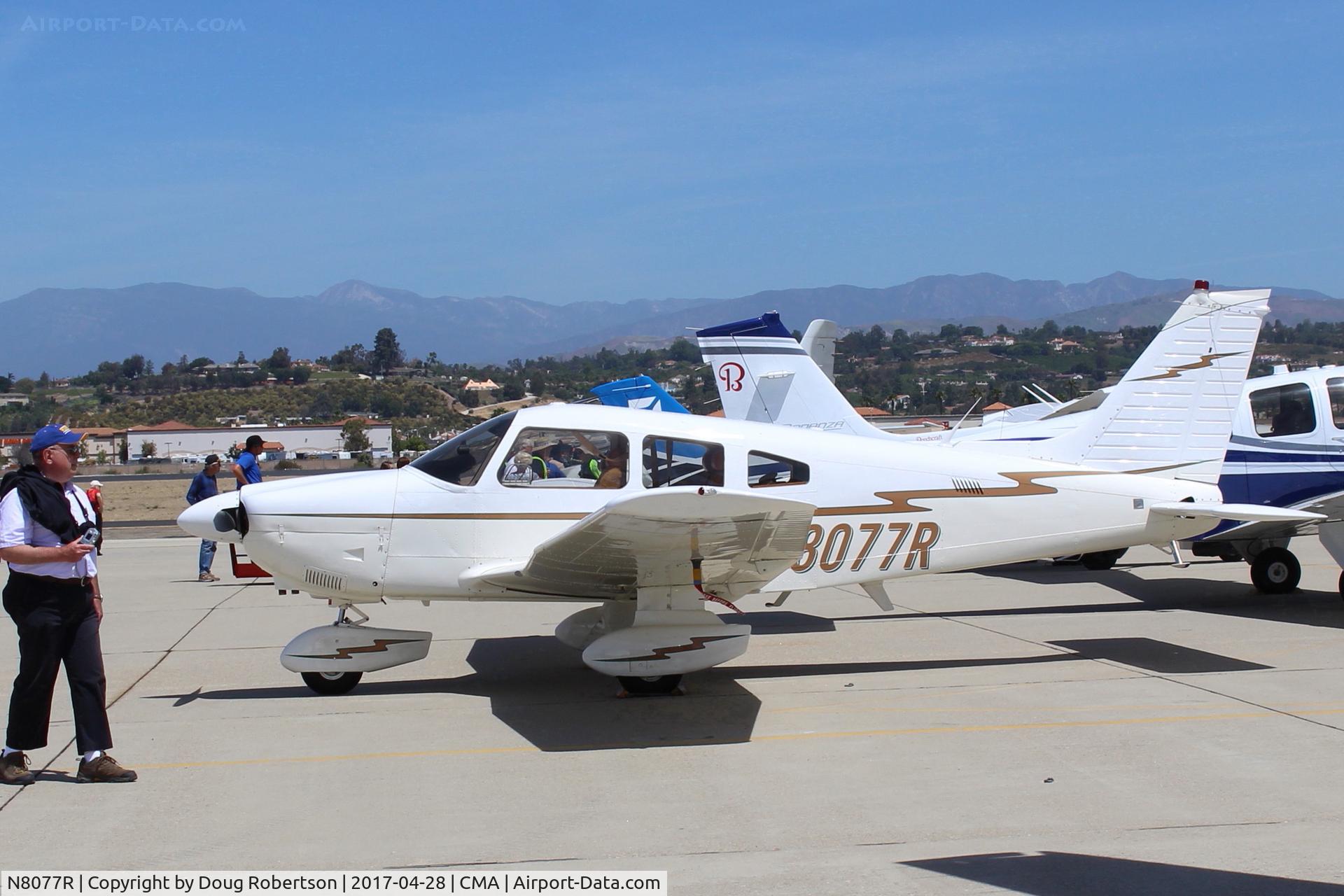 N8077R, 1979 Piper PA-28-181 Archer II C/N 28-8090070, 1979 Piper PA-28-181 ARCHER II, Lycoming O&VO-360 180 Hp, at AOPA FLY-IN, marked volunteers help marshal the traffic, a large fly in attendance!