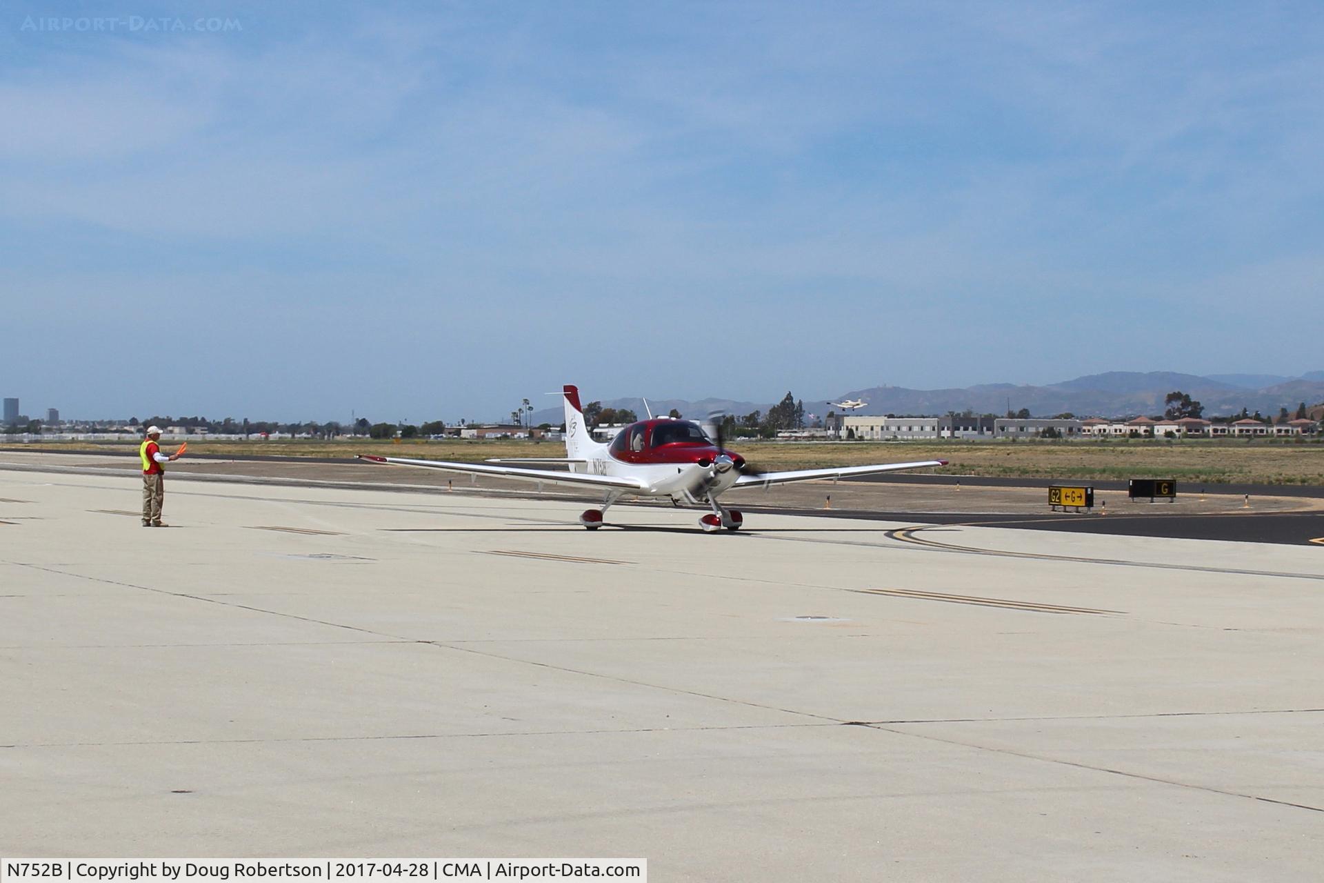 N752B, Cirrus SR22 G3 GTS Turbo C/N 3157, Cirrus SR22 G3 Turbo marked, FAA registry no help on year, engine, taxi to overflow parking. AOPA FLY-IN