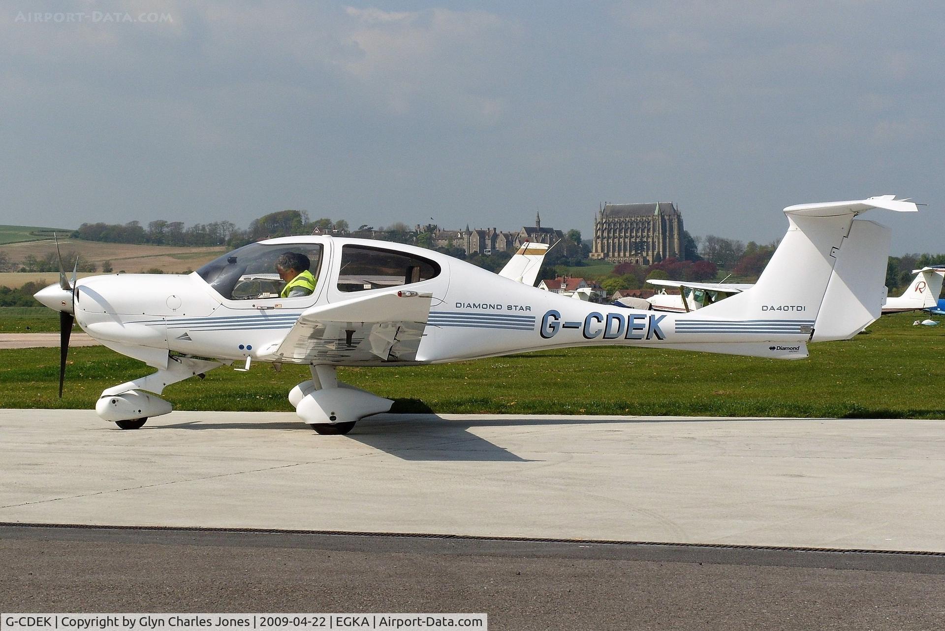 G-CDEK, 2004 Diamond DA-40TDI Diamond Star C/N D4.143, Owned by ADR Aviation. Lancing College in the background.