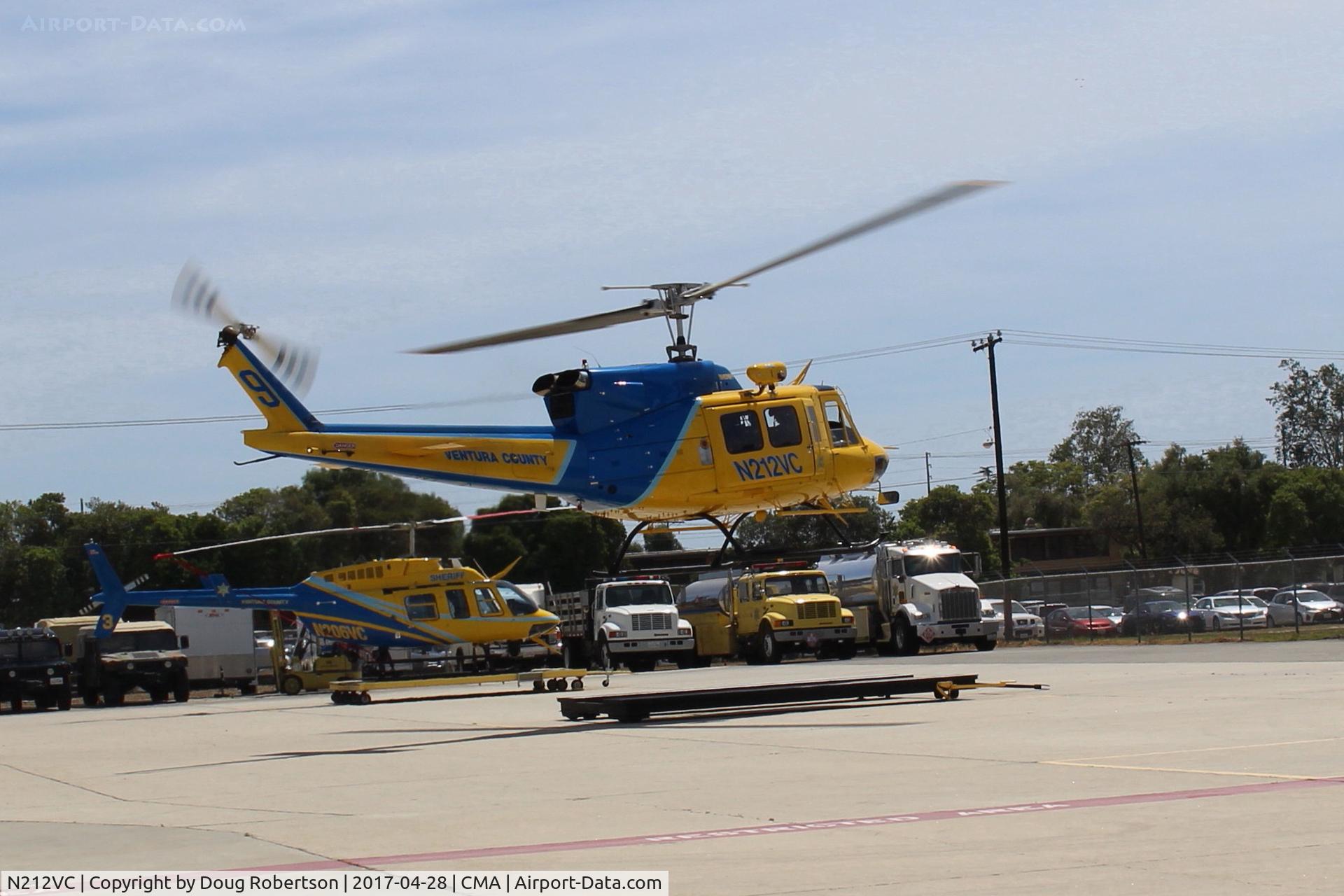 N212VC, 1975 Bell 212 C/N 30693, 1975 Bell 212 Twin Two-Twelve, one 1,800 sHp derated to 1,290 sHp PT6T-3 or one PT6T-3B Turbo Twin Pac comprising 2 coupled PT-6 TSs driving both rotors main & tail. Sheriffs #9  landing on roller pad near their Hangar.