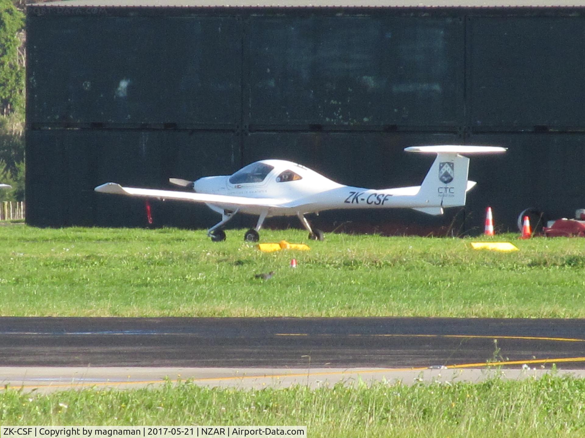 ZK-CSF, Diamond DA-20-C1 Eclipse C/N C0320, long range across airfield in morning sun