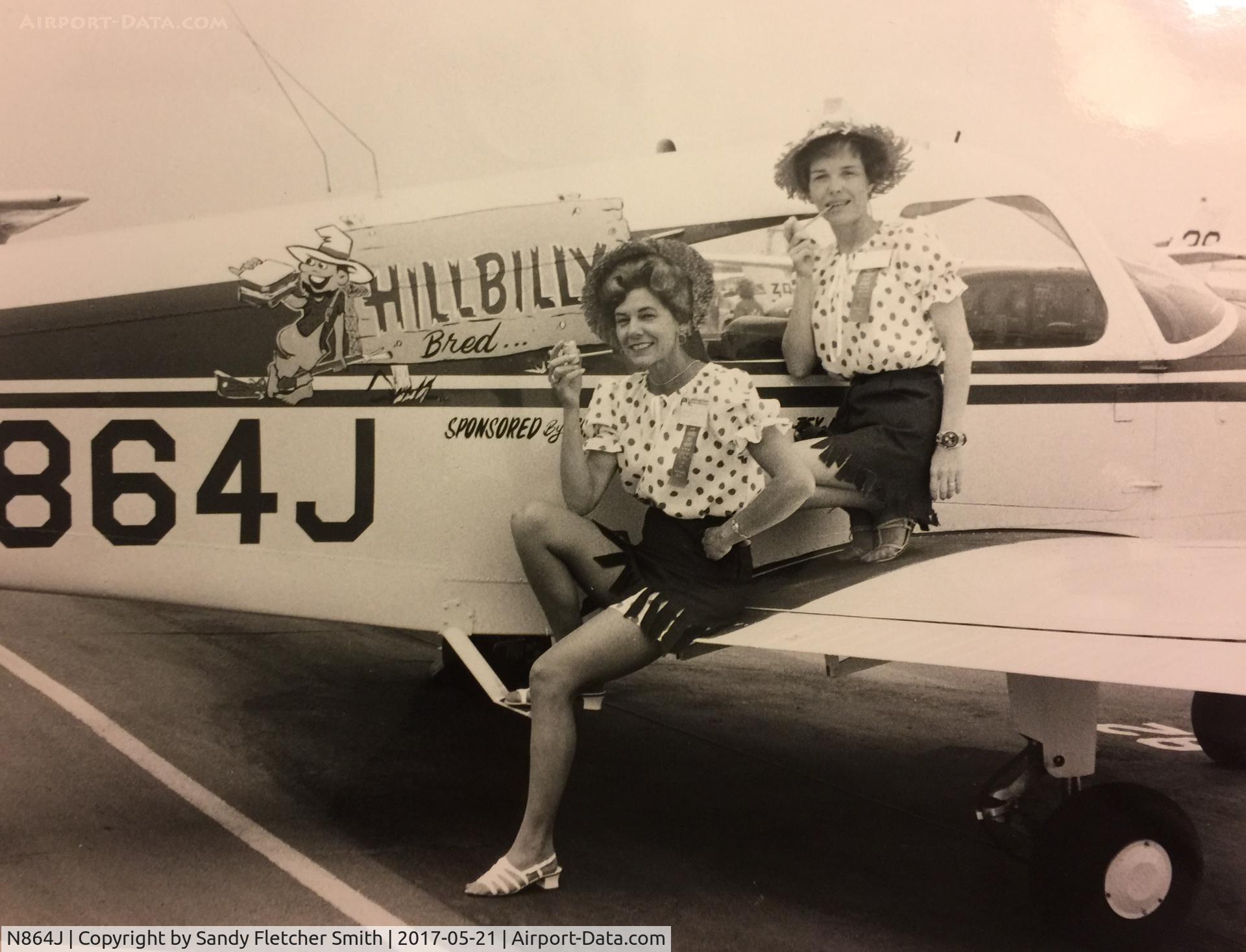 N864J, 1975 Bellanca 7GCBC C/N 864-75, My Mother, Maybelle Fletcher, pictured here on the left, ready for a cross-country air race in about 1975-76. The sponsor was Hillbilly Bread therefore the corncob pipes! N864J Mother passed away at 92 yrs of age last year.  (Prob Hobby Airport)