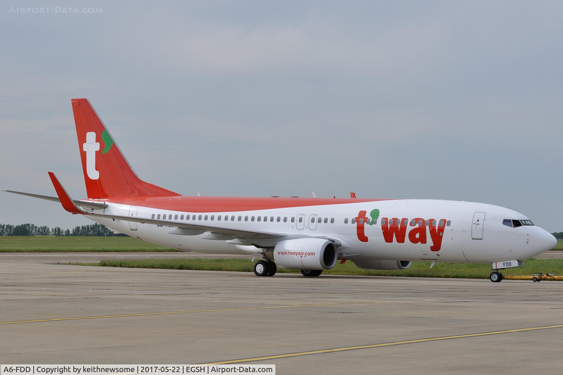 A6-FDD, 2009 Boeing 737-8KN C/N 40234, First real movement since spray from engine runs, South Korean t'way colour scheme.