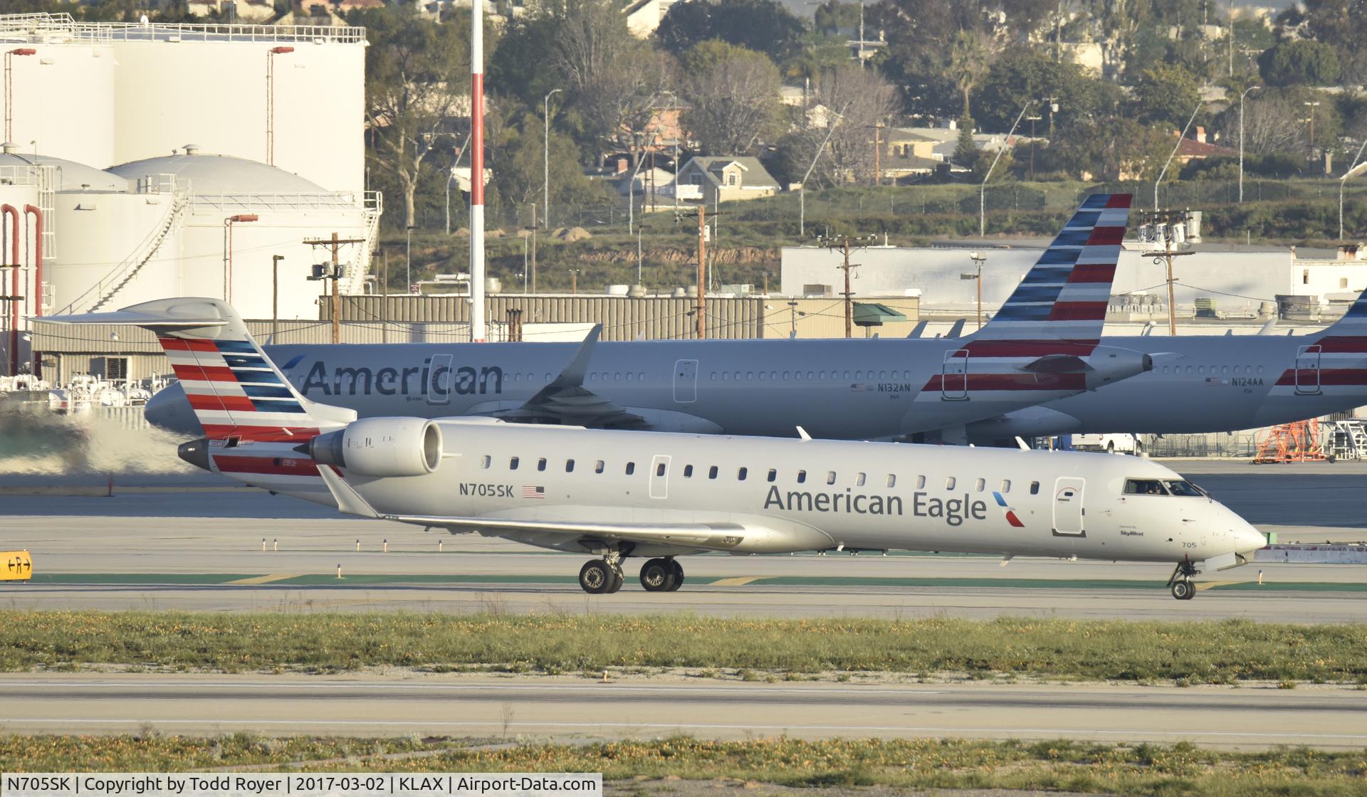 N705SK, 2004 Bombardier CRJ-701 (CL-600-2C10) Regional Jet C/N 10145, Taxiing to gate at LAX