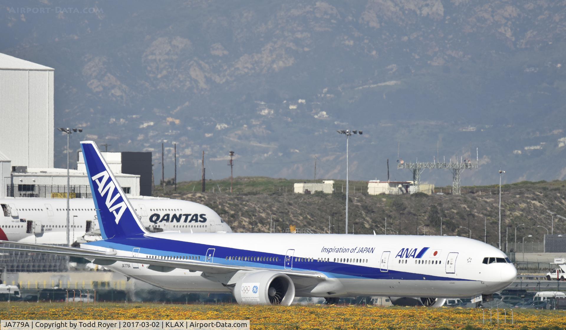 JA779A, 2007 Boeing 777-381/ER C/N 34894, Taxiing through the wild flowers at LAX