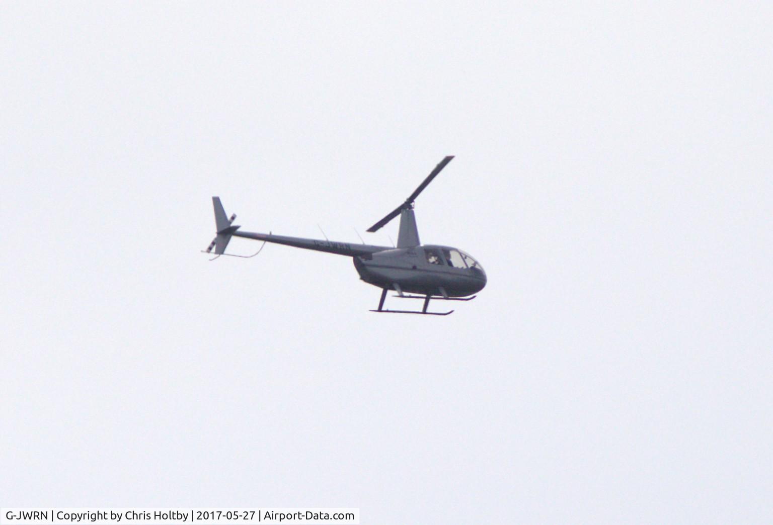 G-JWRN, 2016 Robinson R44 Raven II C/N 13857, Over Potters Bar on 27.5.17