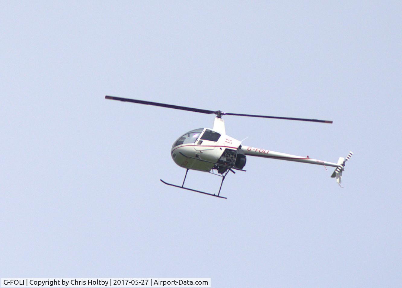 G-FOLI, 1998 Robinson R22 Beta C/N 2813, Over Potters Bar now based at Elstree Airfield, Herts