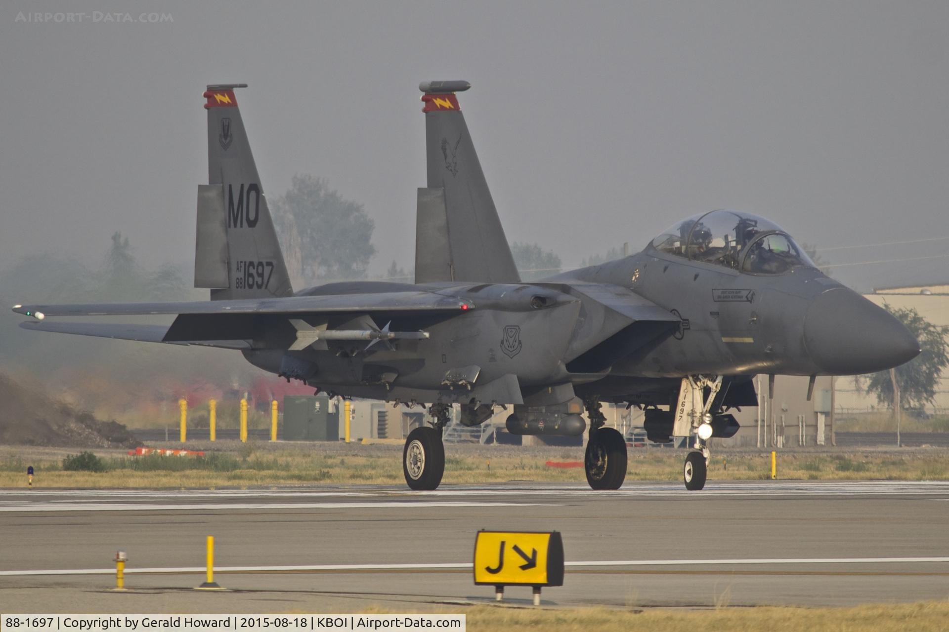 88-1697, 1988 McDonnell Douglas F-15E Strike Eagle C/N 1106/E081, Taxiing onto RWY 10R on a smoky day.  389th Fighter Sq. 