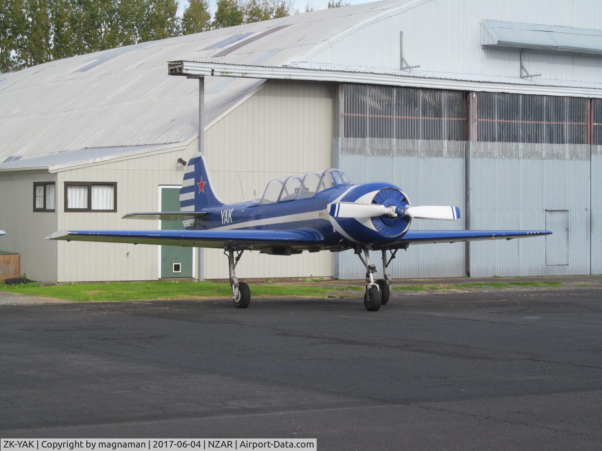 ZK-YAK, Yakovlev Yak-52 C/N 9712002, hiding behind hangars