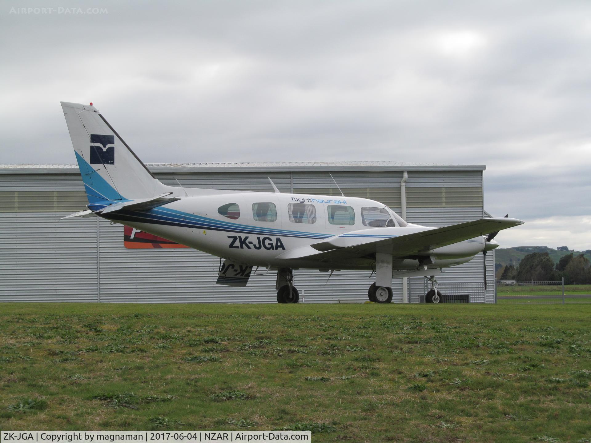 ZK-JGA, Piper PA-31 Navajo C/N 31-7612102, on grass area at ardmore