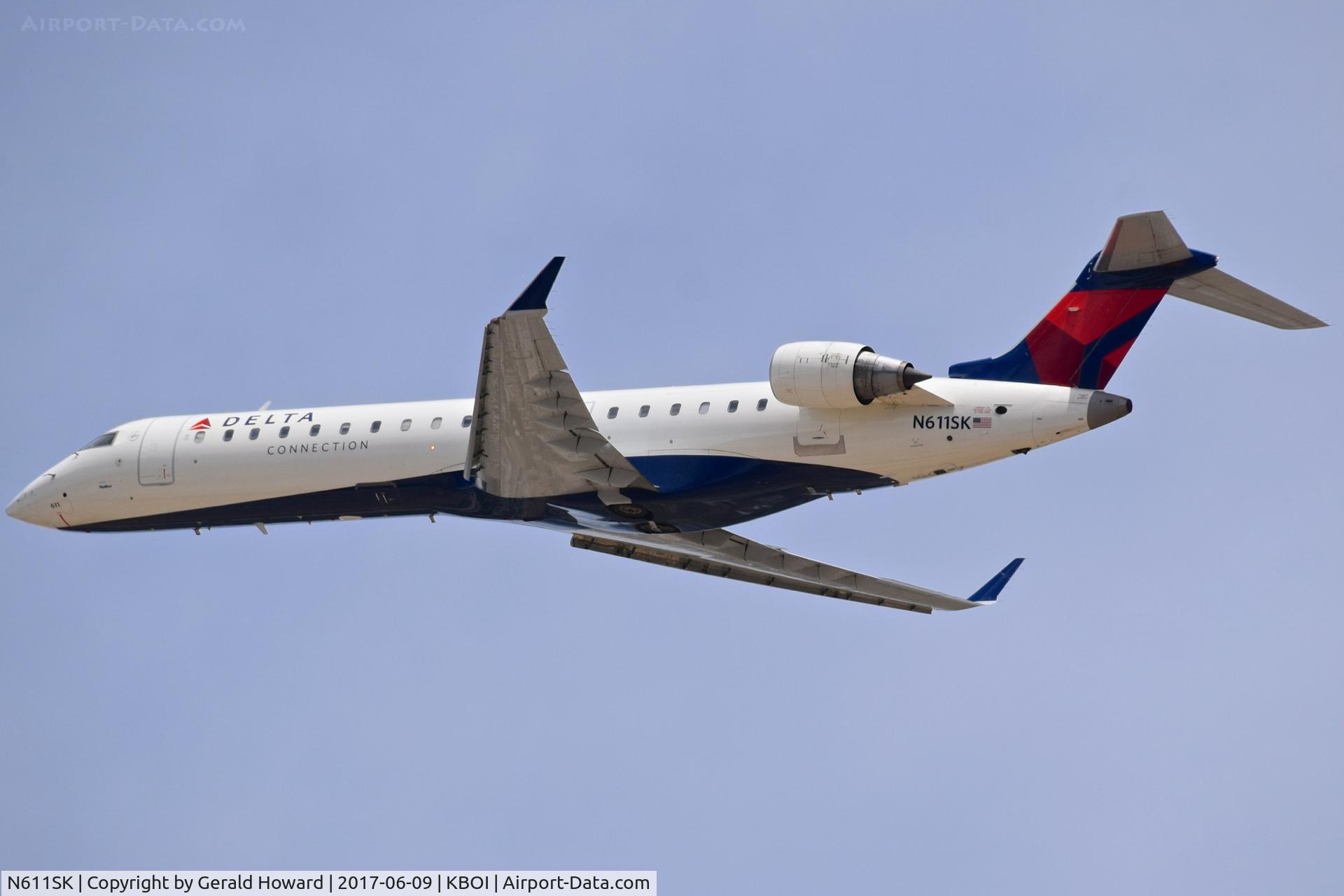 N611SK, 2002 Bombardier CRJ-701 (CL-600-2C10) Regional Jet C/N 10035, Departing BOI from RWY 28R.