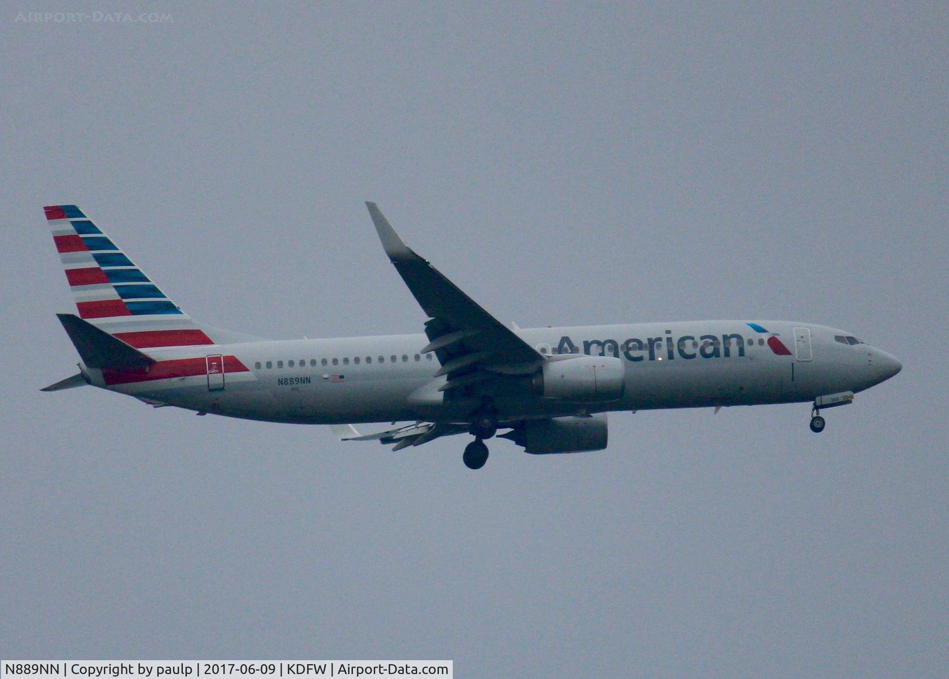 N889NN, 2012 Boeing 737-823 C/N 33314, At DFW. After a 45 minute hold because of severe storms, starting to land in heavy rain.