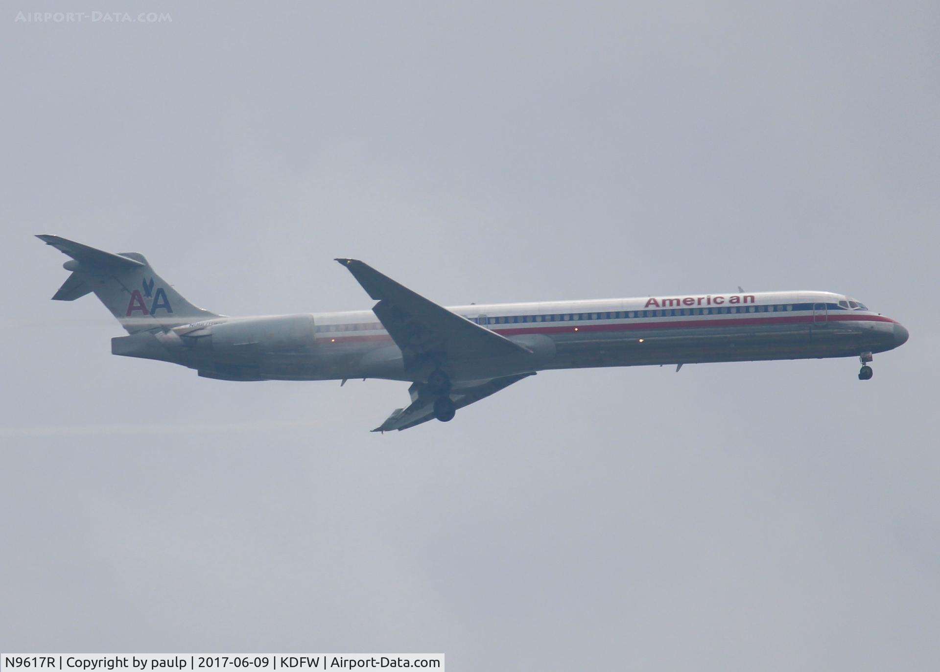 N9617R, 1997 McDonnell Douglas MD-83 (DC-9-83) C/N 53564, At DFW. After a 45 minute hold because of severe storms, starting to land in heavy rain.