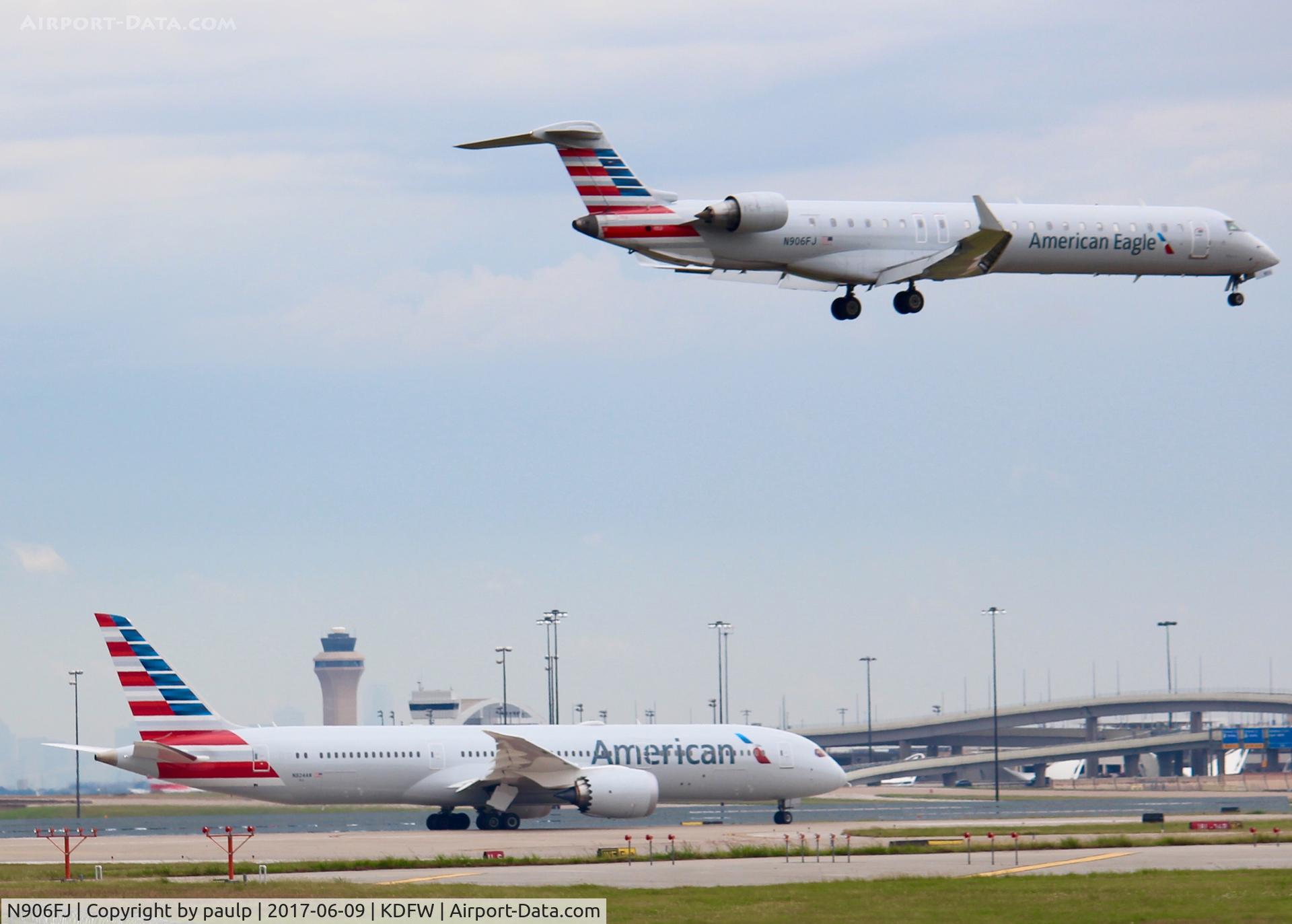 N906FJ, 2003 Bombardier CRJ-900ER (CL-600-2D24) C/N 15006, At DFW. With a 787-9 below it.