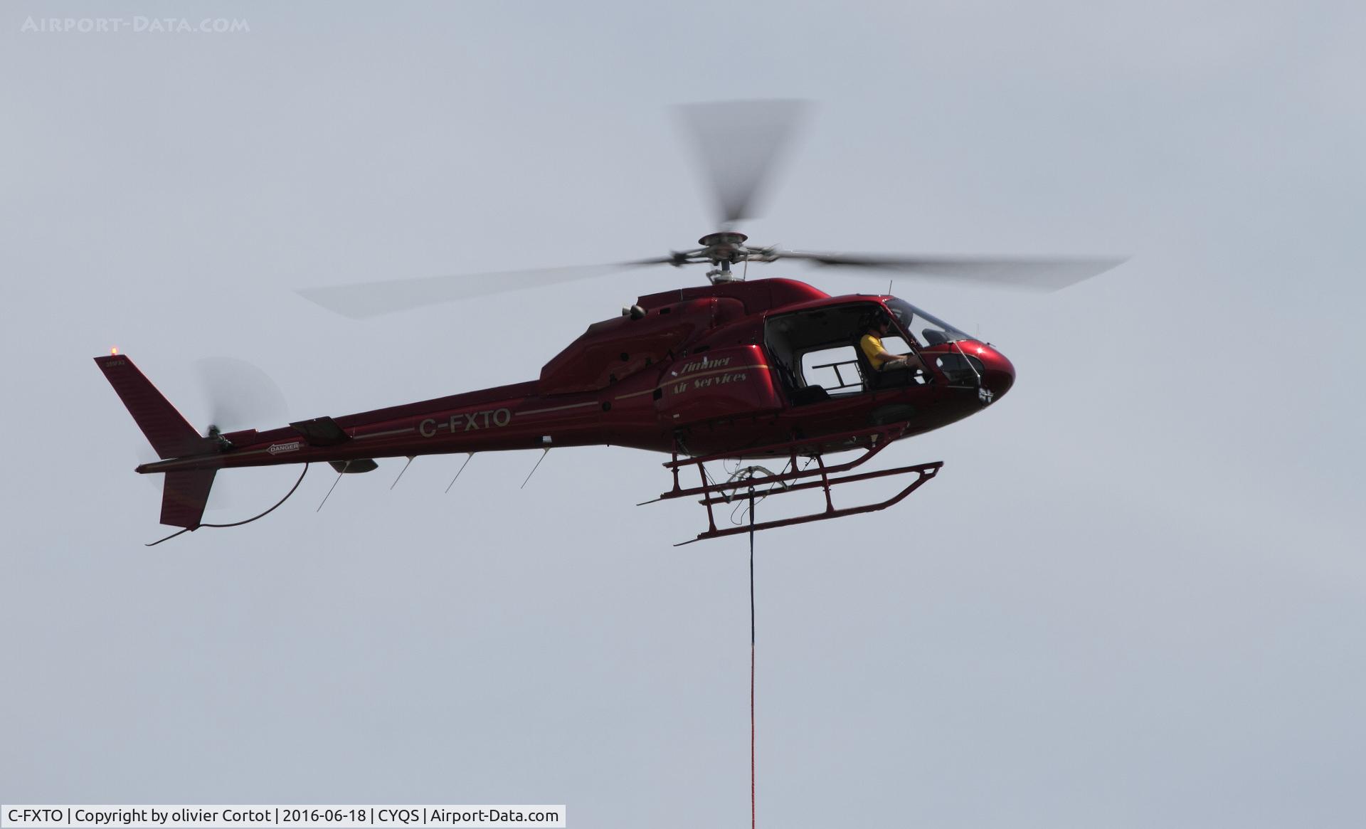 C-FXTO, 1981 Aerospatiale AS-355F-2 Ecureuil 2 C/N 5087, about to drop a car during the 2016 St Thomas airshow !
