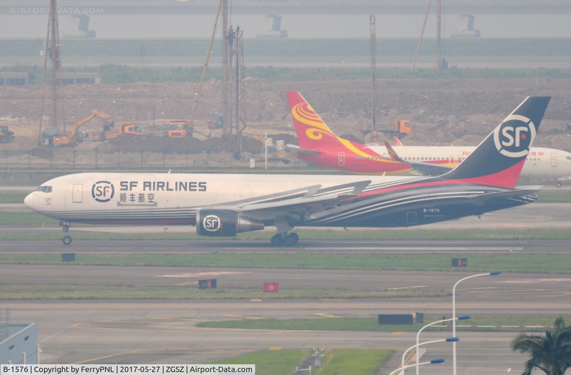 B-1576, 1997 Boeing 767-338/ER(BCF) C/N 28724, SF B763F in smoggy SZX