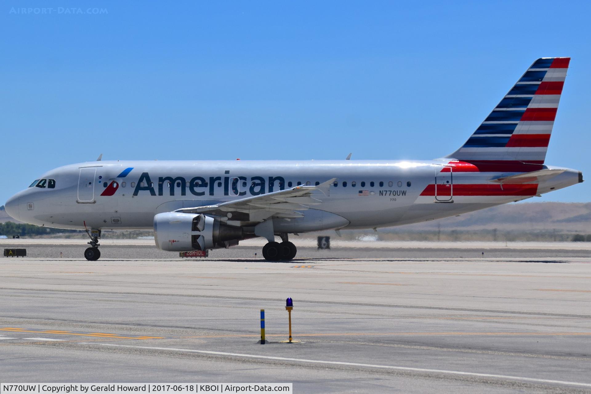N770UW, 2000 Airbus A319-112 C/N 1393, Off Echo onto Alpha and onto the gate. Reverse thrusters still opened.
