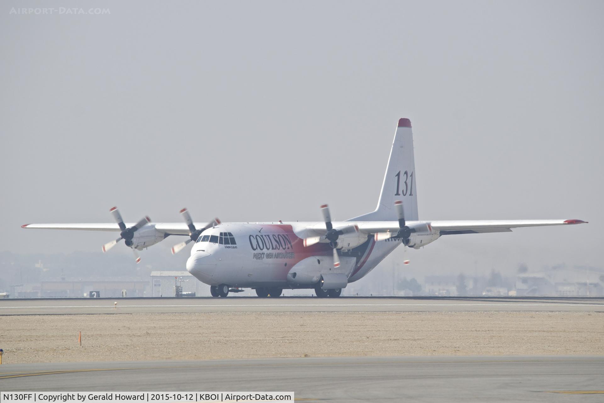 N130FF, 1980 Lockheed EC-130Q Hercules C/N 382-4901, Back taxi on RWY 28R on a IFR smoke filled day.