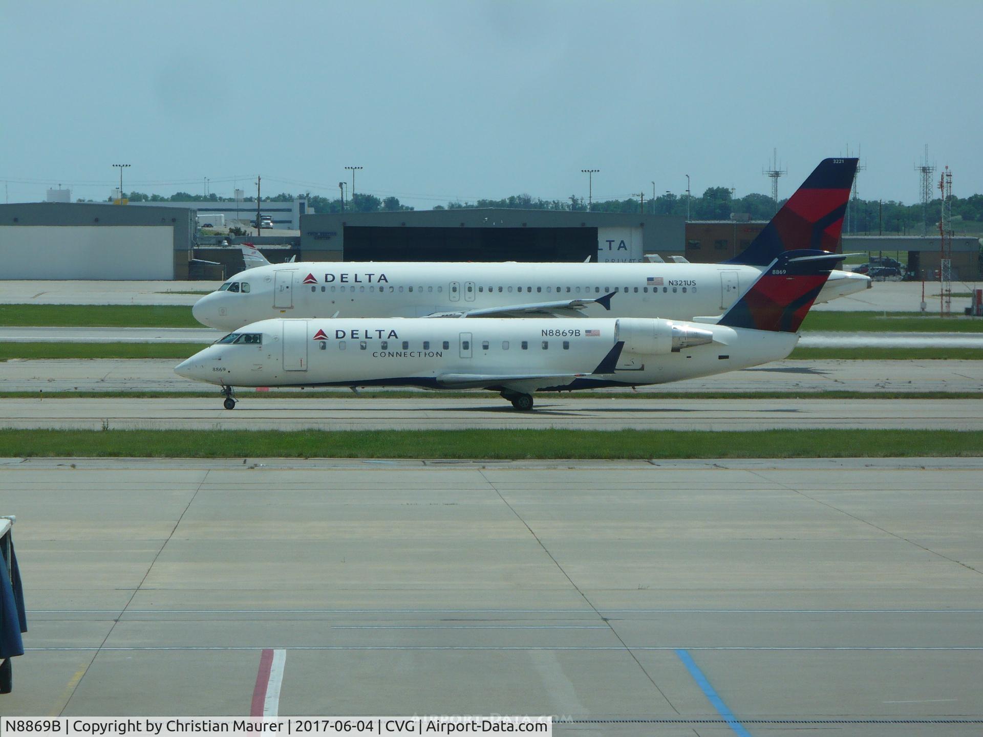 N8869B, 2003 Canadair CRJ-440 (CL-600-2B19) Regional Jet C/N 7869, CRJ-440 infront of 321US after a rejected takeoff