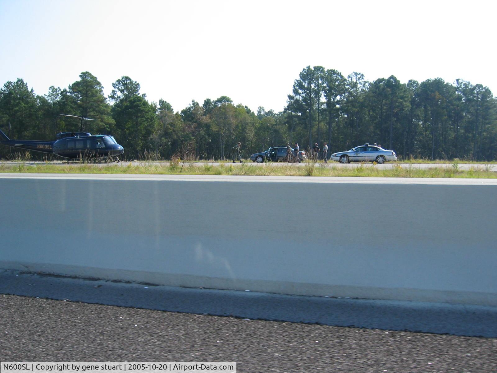 N600SL, Bell UH-1H C/N 64-13562, parked on the side of SC31 around 11am, conferencing with two SC highway patrol cars