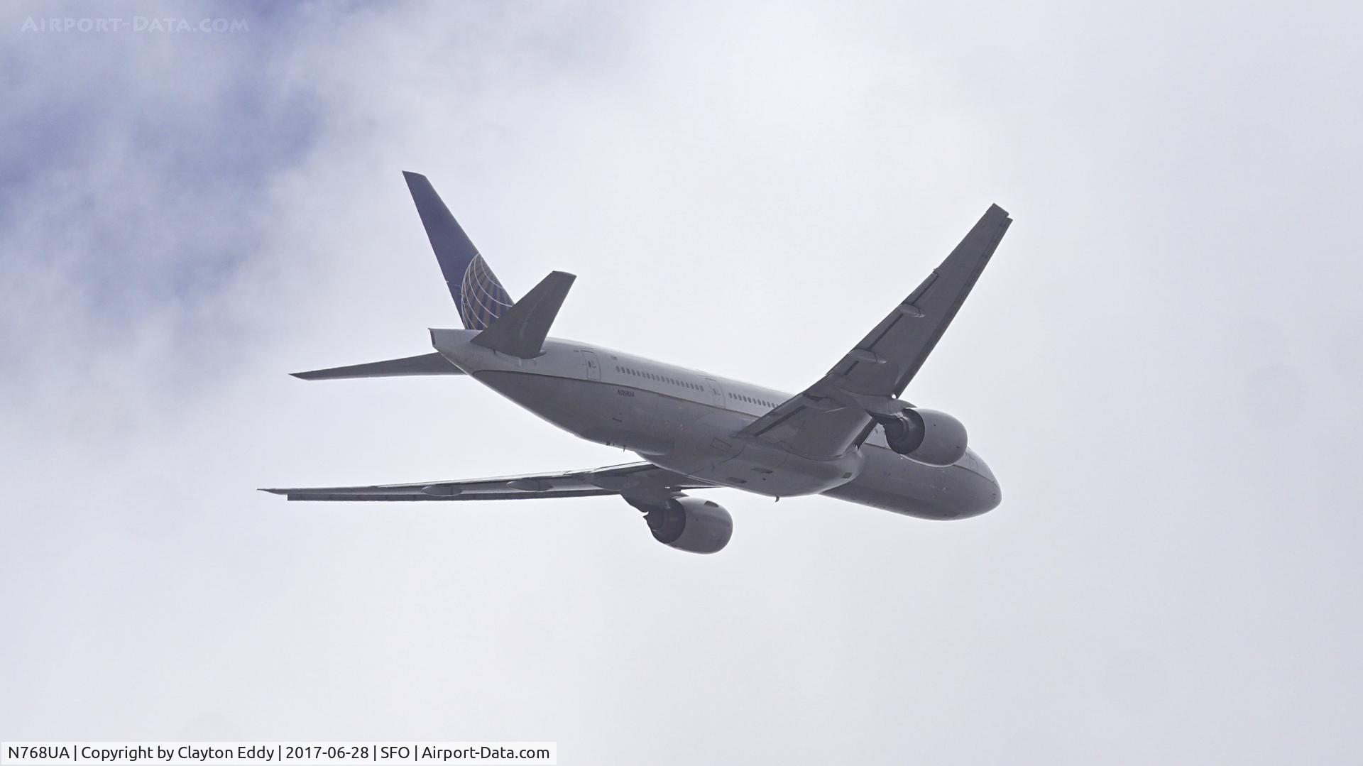 N768UA, 1995 Boeing 777-222 C/N 26919, Departing runway 28L into a fog bank at SFO. 2017.