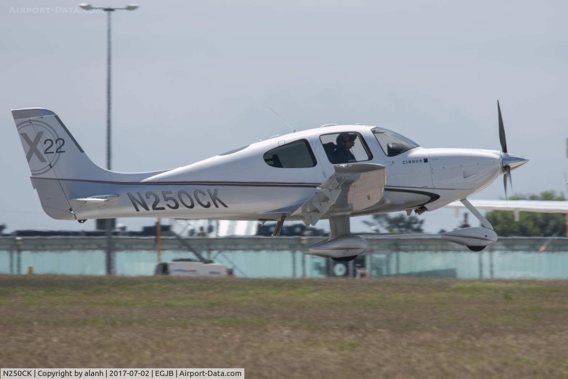 N250CK, 2009 Cirrus SR22X C/N 3421, About to touch down on 27 at Guernsey