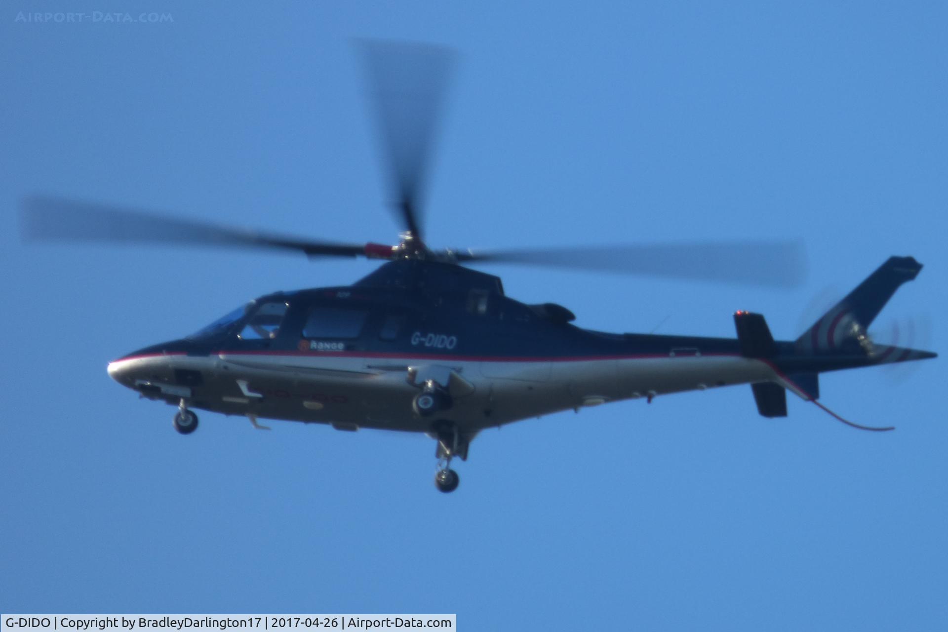 G-DIDO, 2004 Agusta A-109E Power C/N 11617, Castle Air (the range) over plymouth towards derriford