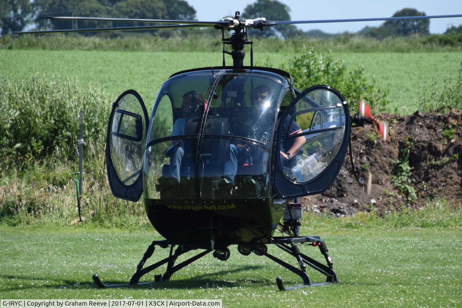 G-IRYC, 2004 Schweizer 269C-1 C/N 0194, Just landed at Northrepps.