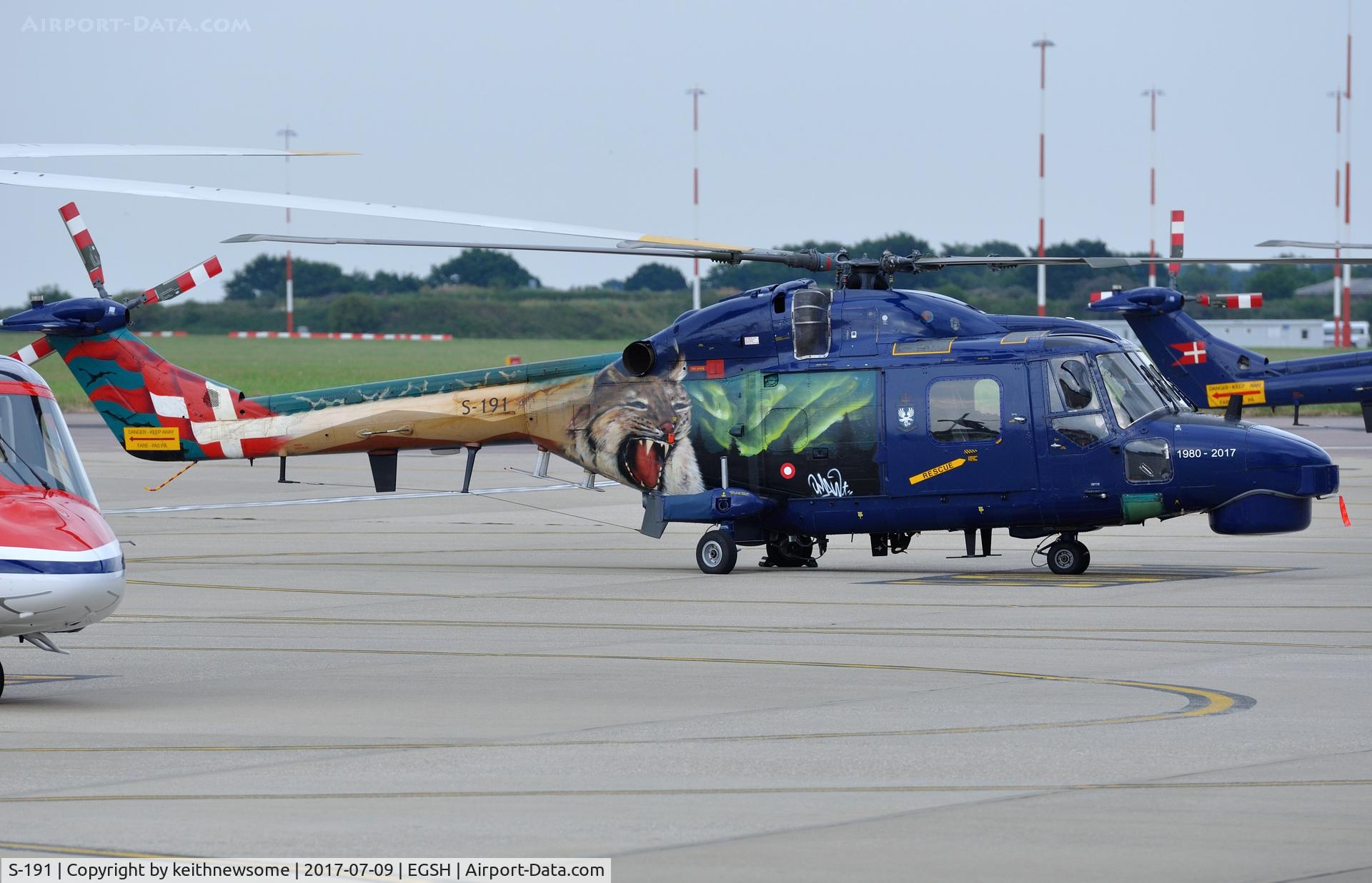 S-191, 1980 Westland Super Lynx Mk.90B C/N 409, Parked at Norwich with other traffic.