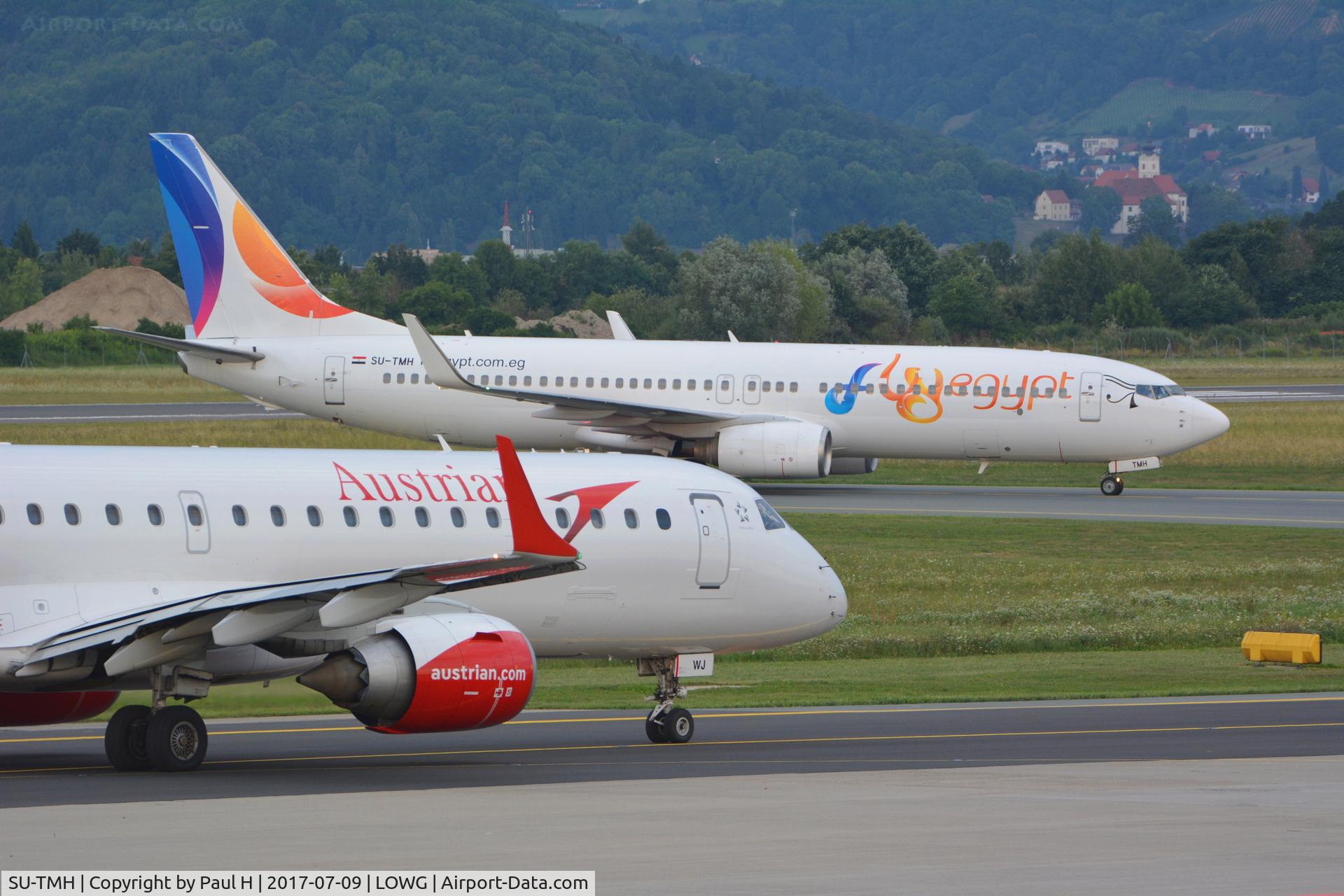 SU-TMH, 2007 Boeing 737-8GJ C/N 34903, SkyEgypt B737 (SU-TMH) with an Austrian Airlines ERJ-195 (OE-LWJ)