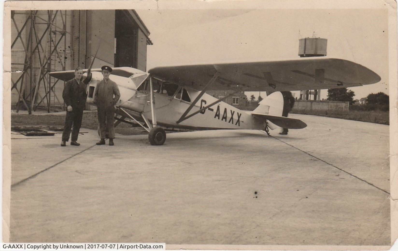 G-AAXX, De Havilland DH80A Puss Moth C/N 2028, In a collection of photos once belonging to my father WO C.E.Lutwyche 561197 who was in the RAF from 1928 to 1942. He is the person in overalls and cap.
