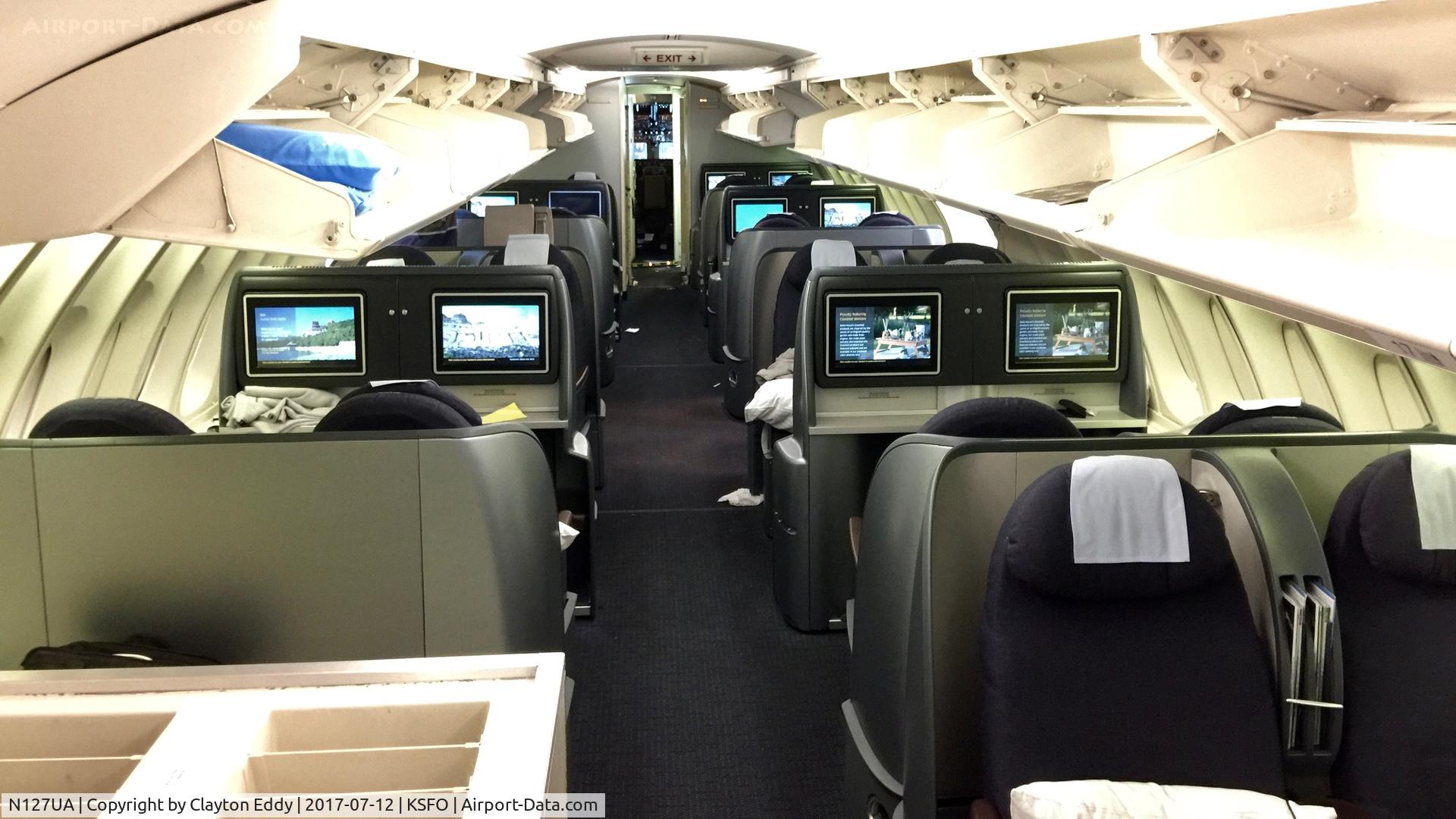 N127UA, 1999 Boeing 747-422 C/N 28813, Upper deck, flightdeck door open. SFO. 2017.