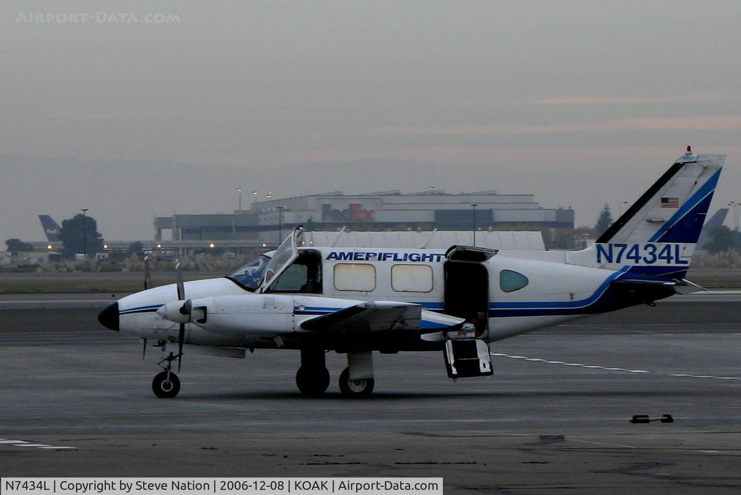 N7434L, 1972 Piper PA-31-310 Navajo C/N 31-822, AMERIFLIGHT 1972 Piper PA-31-310 Navajo small package carrier @ Oakland International Airport North ramp home base