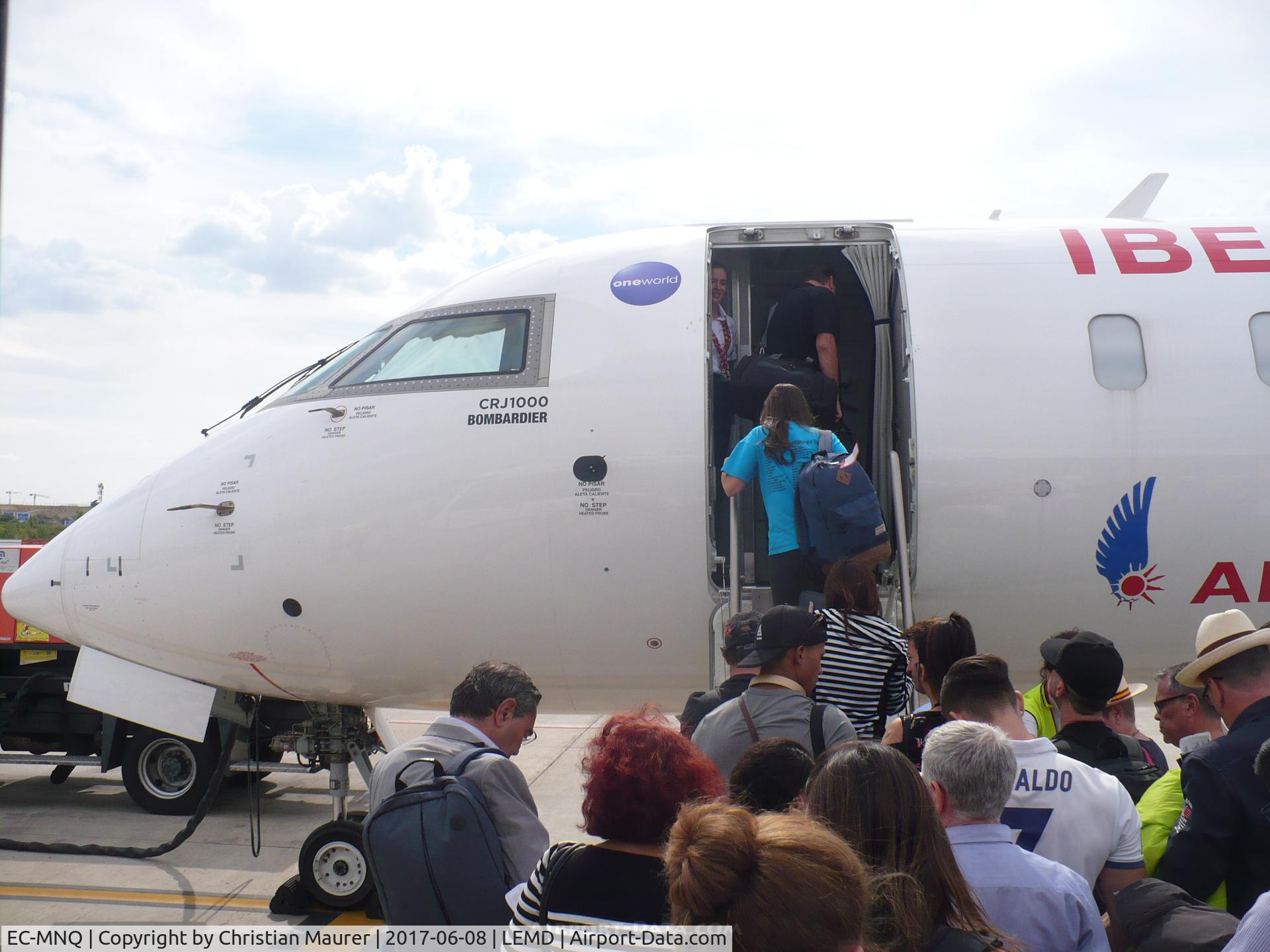 EC-MNQ, 2016 Bombardier CRJ-1000ER NG (CL-600-2E25) C/N 19051, CRJ-1000ER on a remote stand boarding by the very unusual way; The door's built in stairs!