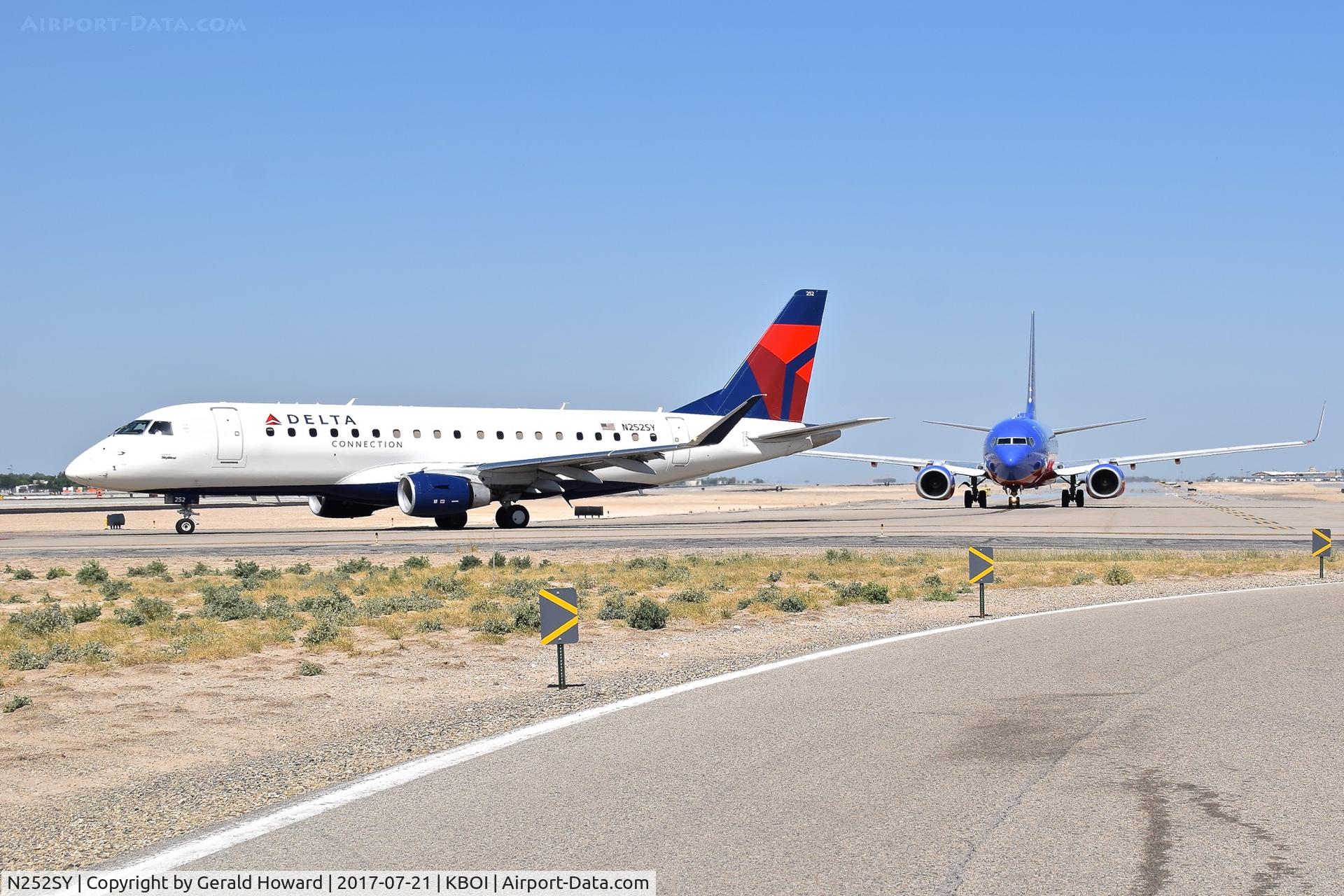 N252SY, 2016 Embraer 175LR (ERJ-170-200LR) C/N 17000612, Turning onto RWY 28R from Alpha with N252WN right behind.
