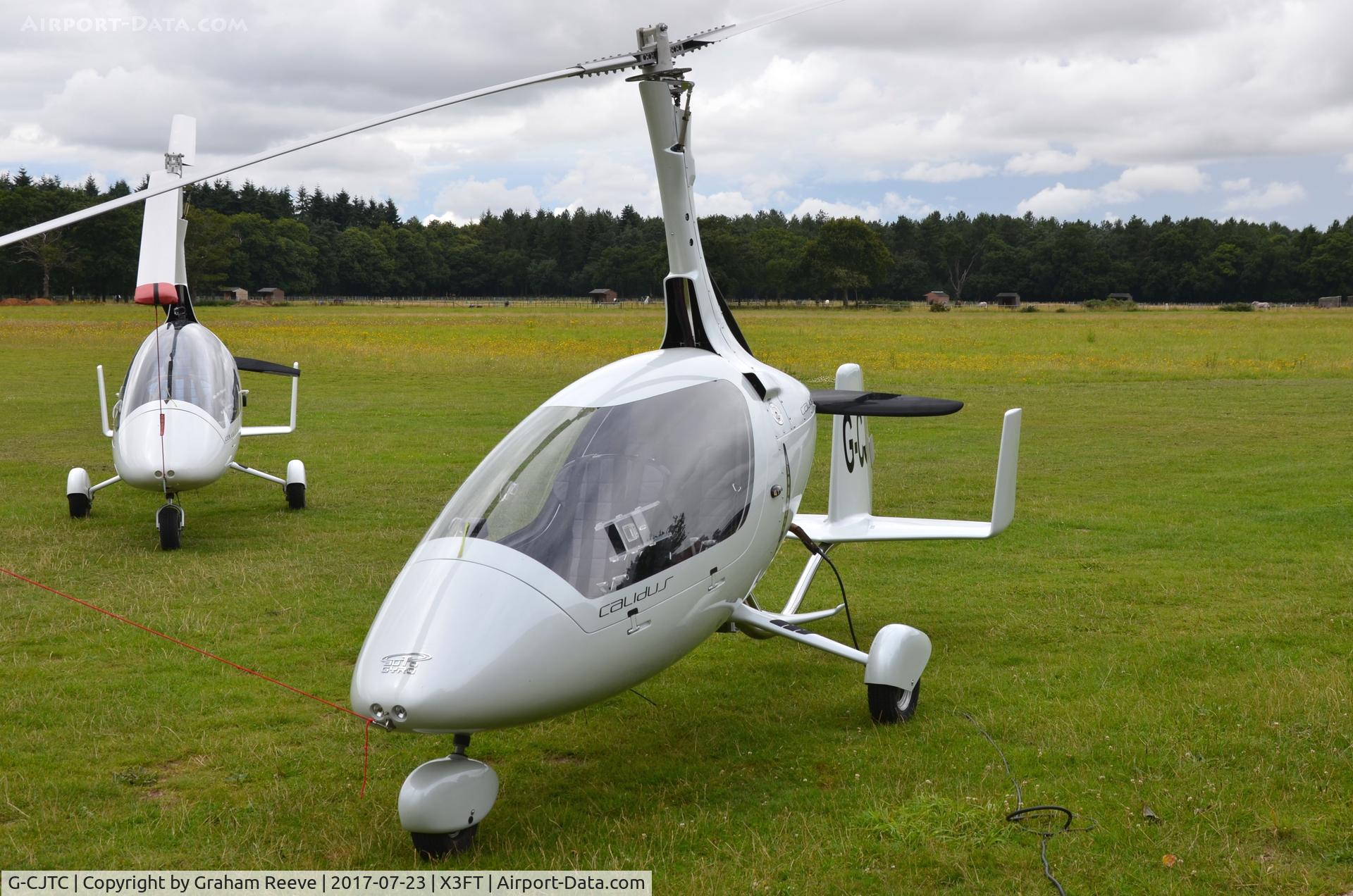 G-CJTC, 2017 RotorSport UK Calidus C/N RSUK/CALS/032, Parked at Felthorpe, with G-ULUL behind.