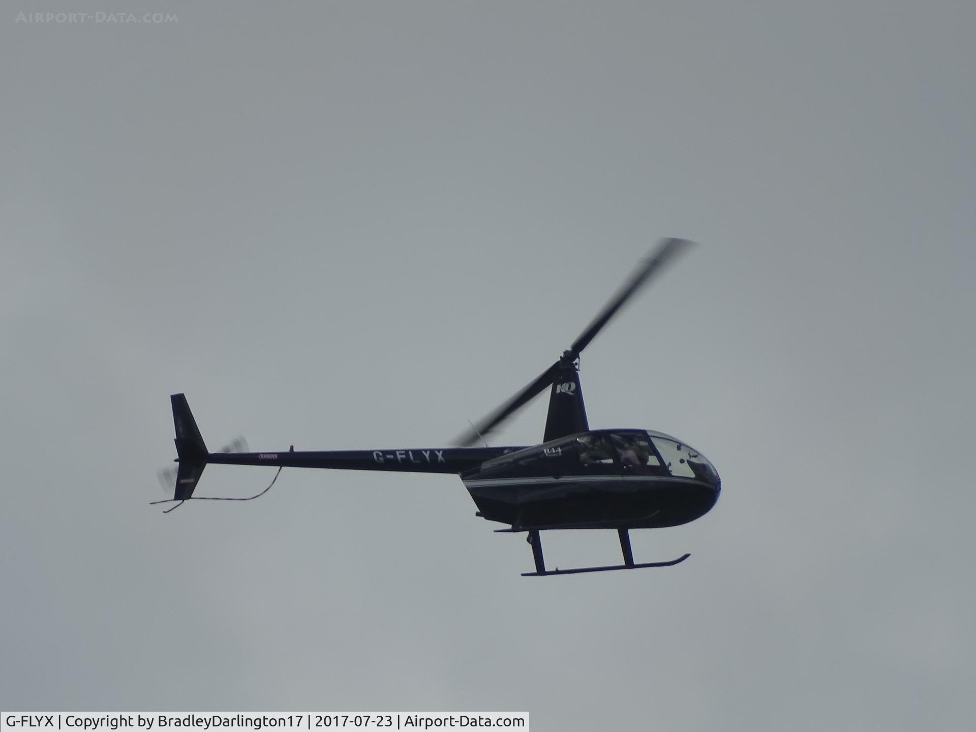 G-FLYX, 2007 Robinson R44 Raven II C/N 11669, G-FLYX Over Plymouth