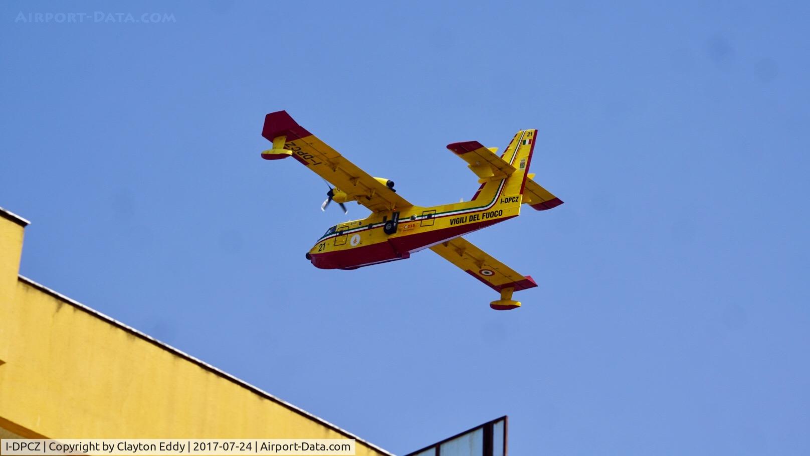 I-DPCZ, 2000 Bombardier CL-415 (CL-215-6B11) C/N 2048, Flying over Scalea Italy after loading up on water in the Mediterranean.