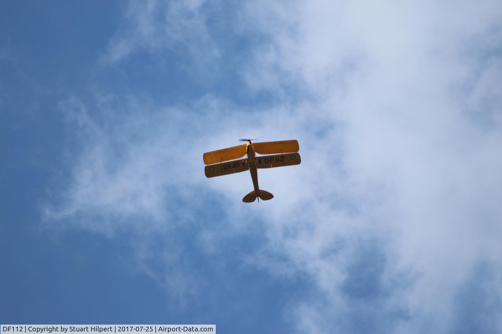 DF112, 1942 De Havilland DH-82A Tiger Moth II C/N 85861, Seen flying over Fen Drayton, Cambridgeshire.