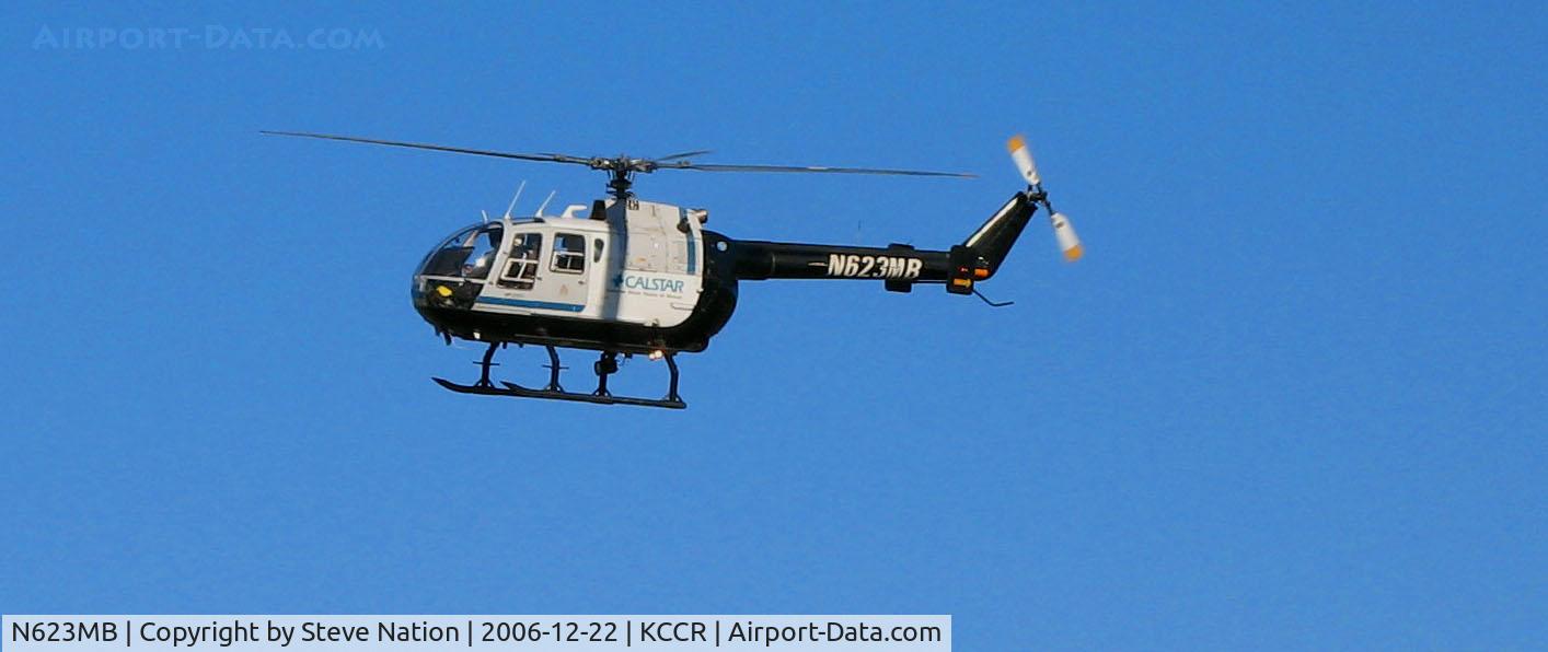 N623MB, 1986 MBB Bo-105CBS-5 C/N S-750, CALSTAR 1986 MBB BO-105 medical helicopter on final turn for landing on company ramp behind general aviation terminal @ Buchanan Field, Concord, CA