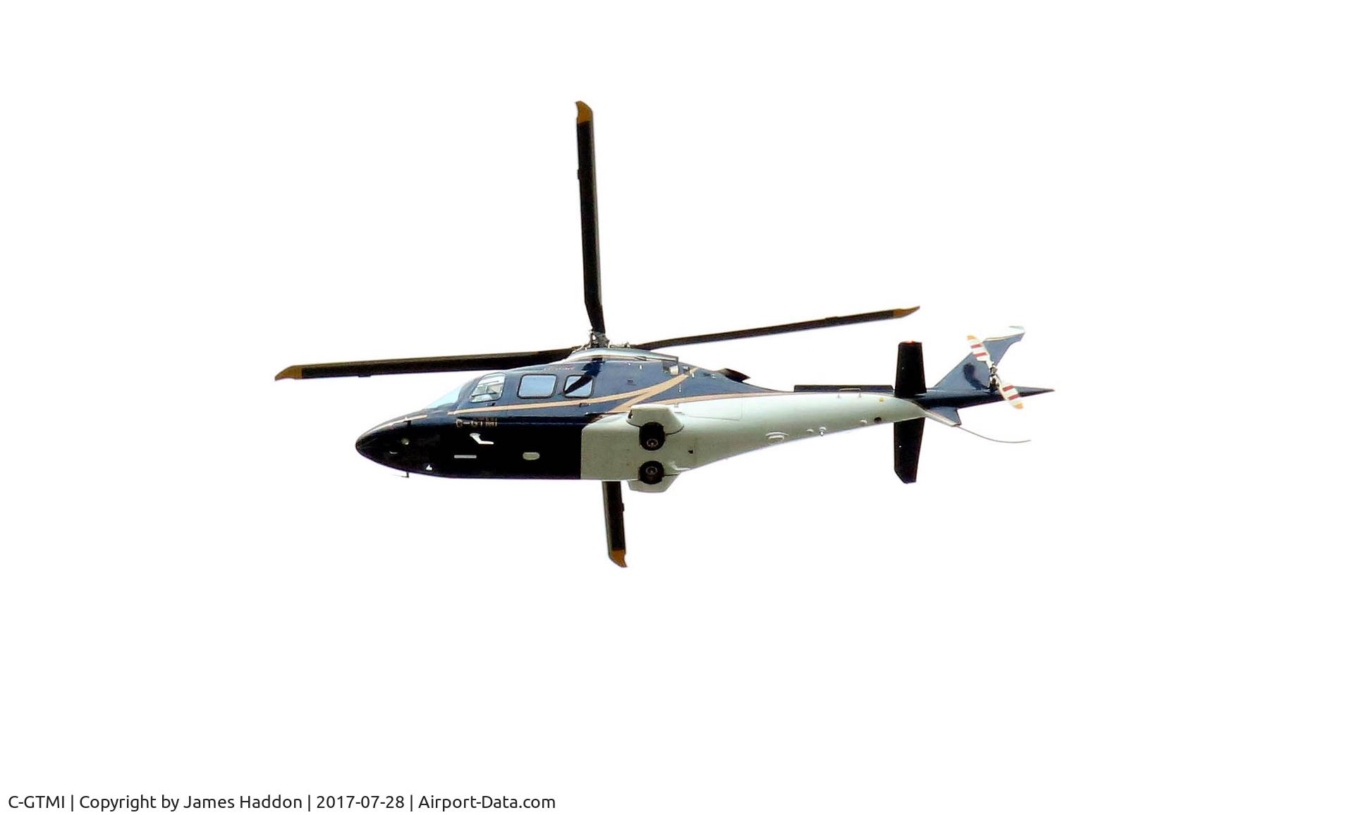 C-GTMI, 2010 Agusta A-109S Grand C/N 22160, Flying south from Barrie, Ontario towards Toronto.