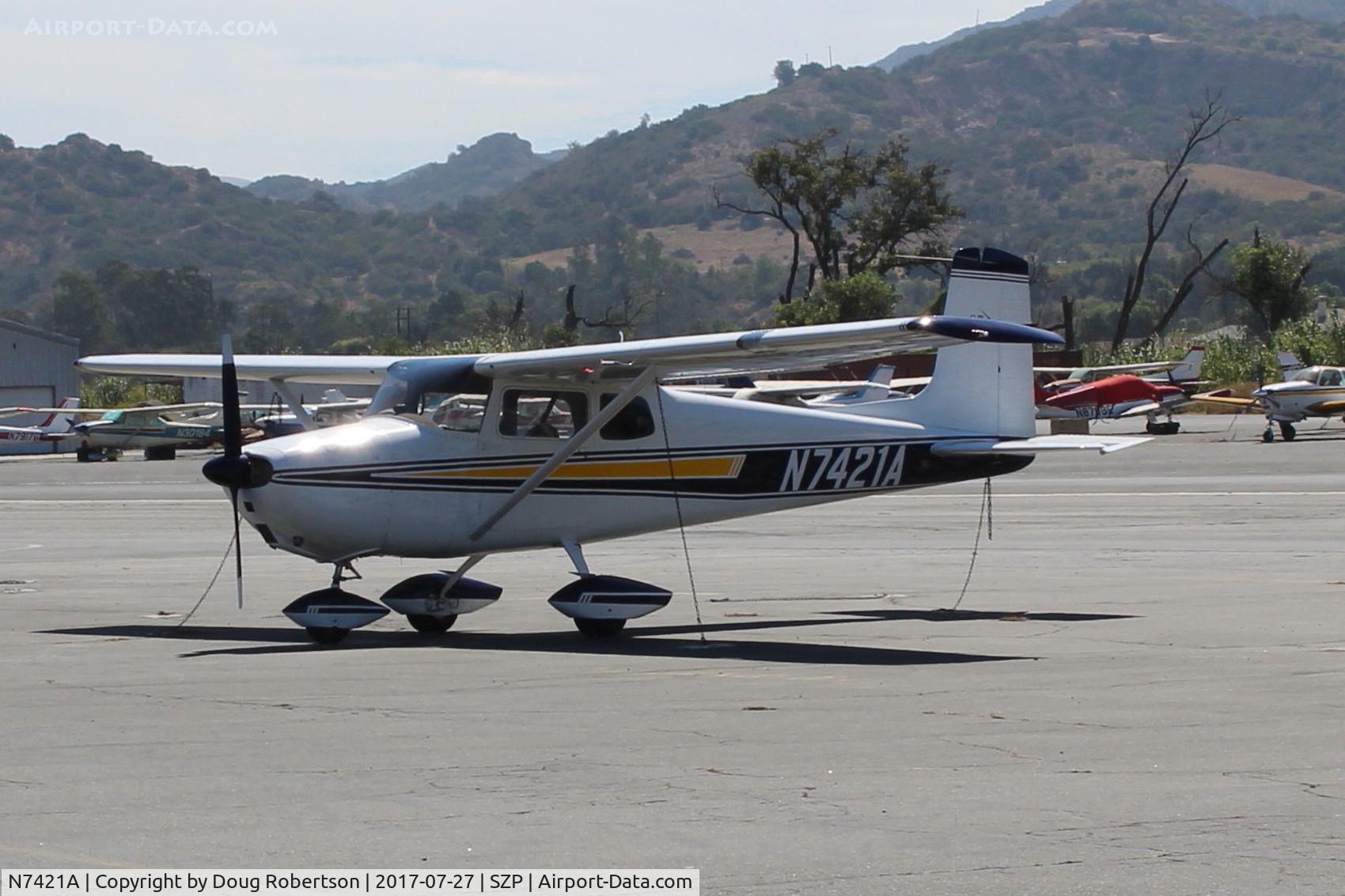 N7421A, 1956 Cessna 172 C/N 29521, 1956 Cessna 172, Continental O-300-A 145 Hp, first year of production, not yet a named Skyhawk. On SZP Transient ramp.