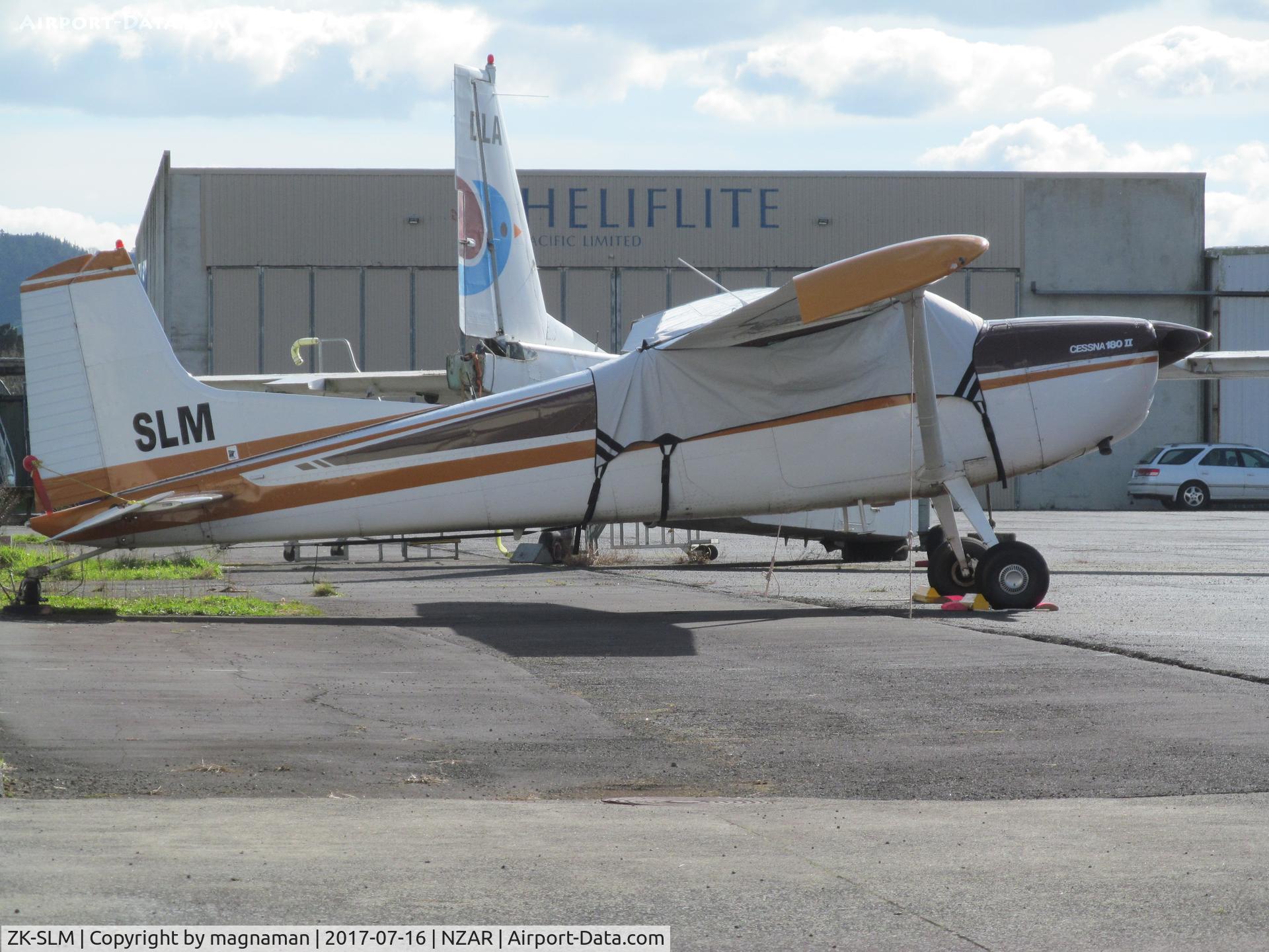 ZK-SLM, 1979 Cessna 180K Skywagon C/N 18053016, outside hangar at AMZ