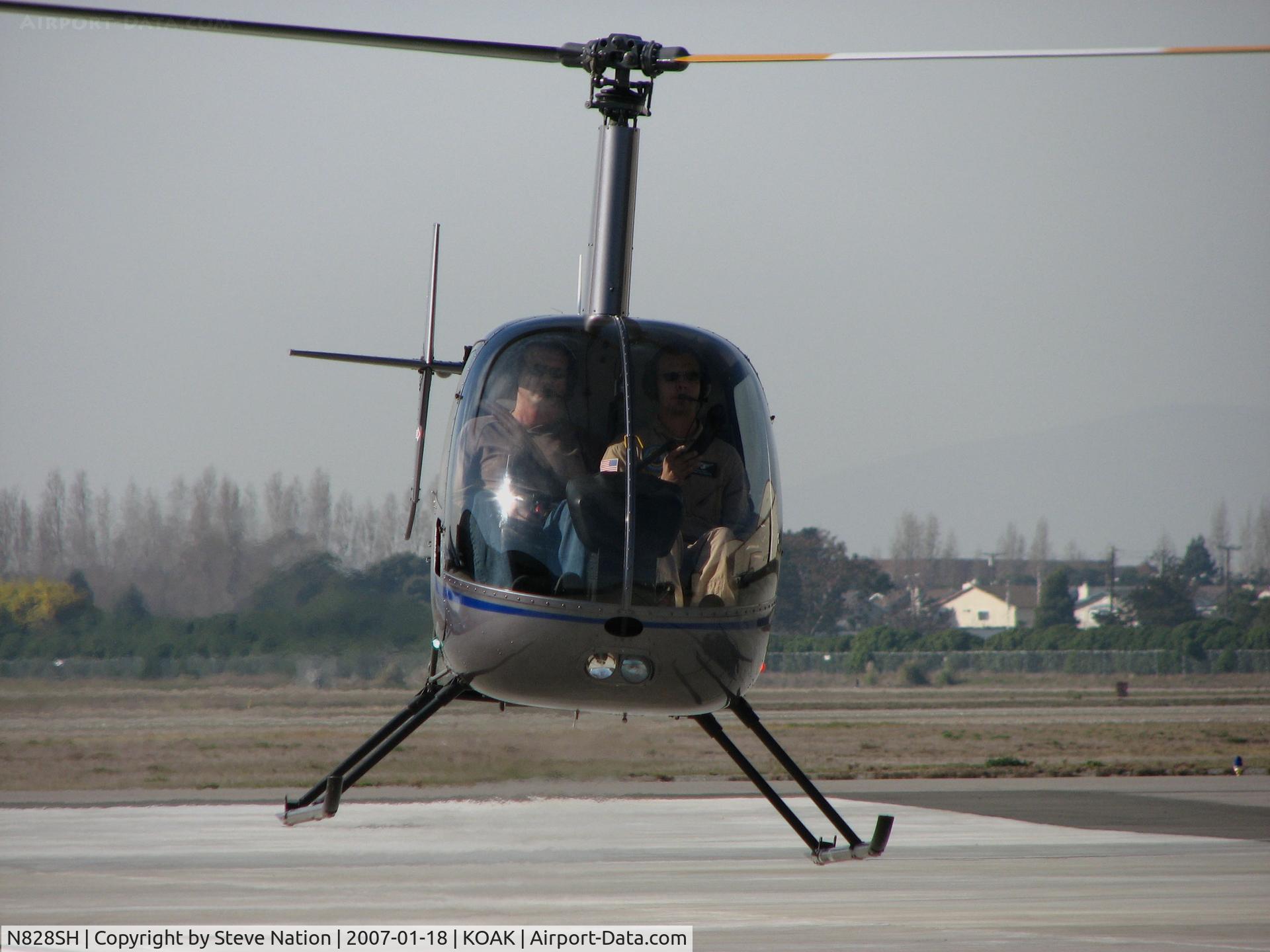 N828SH, 2005 Robinson R22 Beta C/N 3786, Silver State Helicopters 2005 Robinson R22 BETA in head-on hover @ Oakland International Airport, CA North ramp (to Humbird Helicopters 2009-08-07)