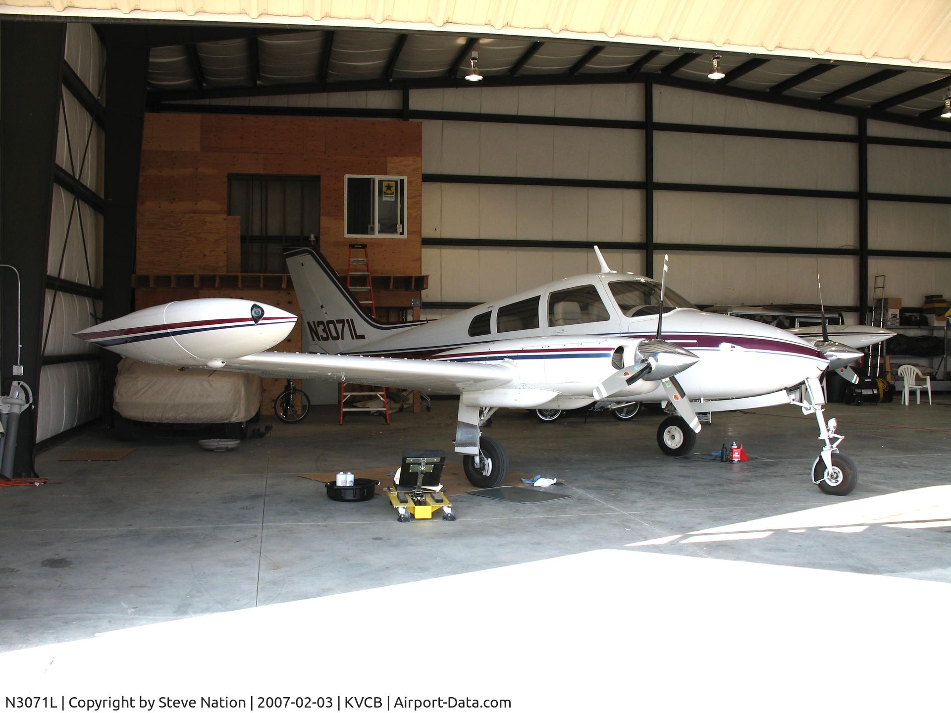 N3071L, 1965 Cessna 310J C/N 310J0071, Locally-based 1965 Cessna 310J in open hangar @ Nut Tree Airport, Vacaville, CA (sold to new owner in Fort Walton Beach, FL 2011-04-26)