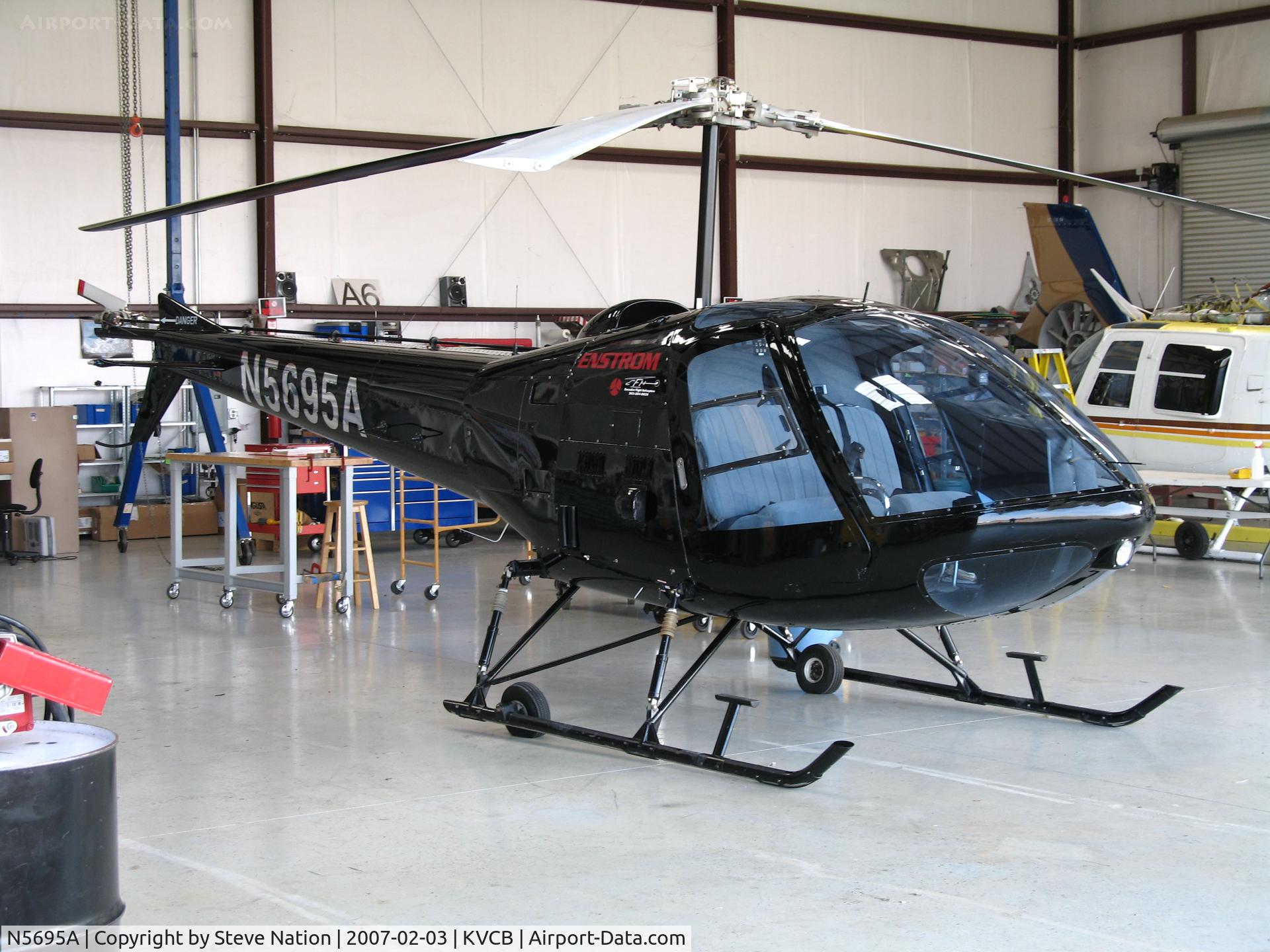 N5695A, Enstrom 280C Shark C/N 1201, Locally-based 1980 Enstrom 280C in open hangar @ Nut Tree Airport, Vacaville, CA
