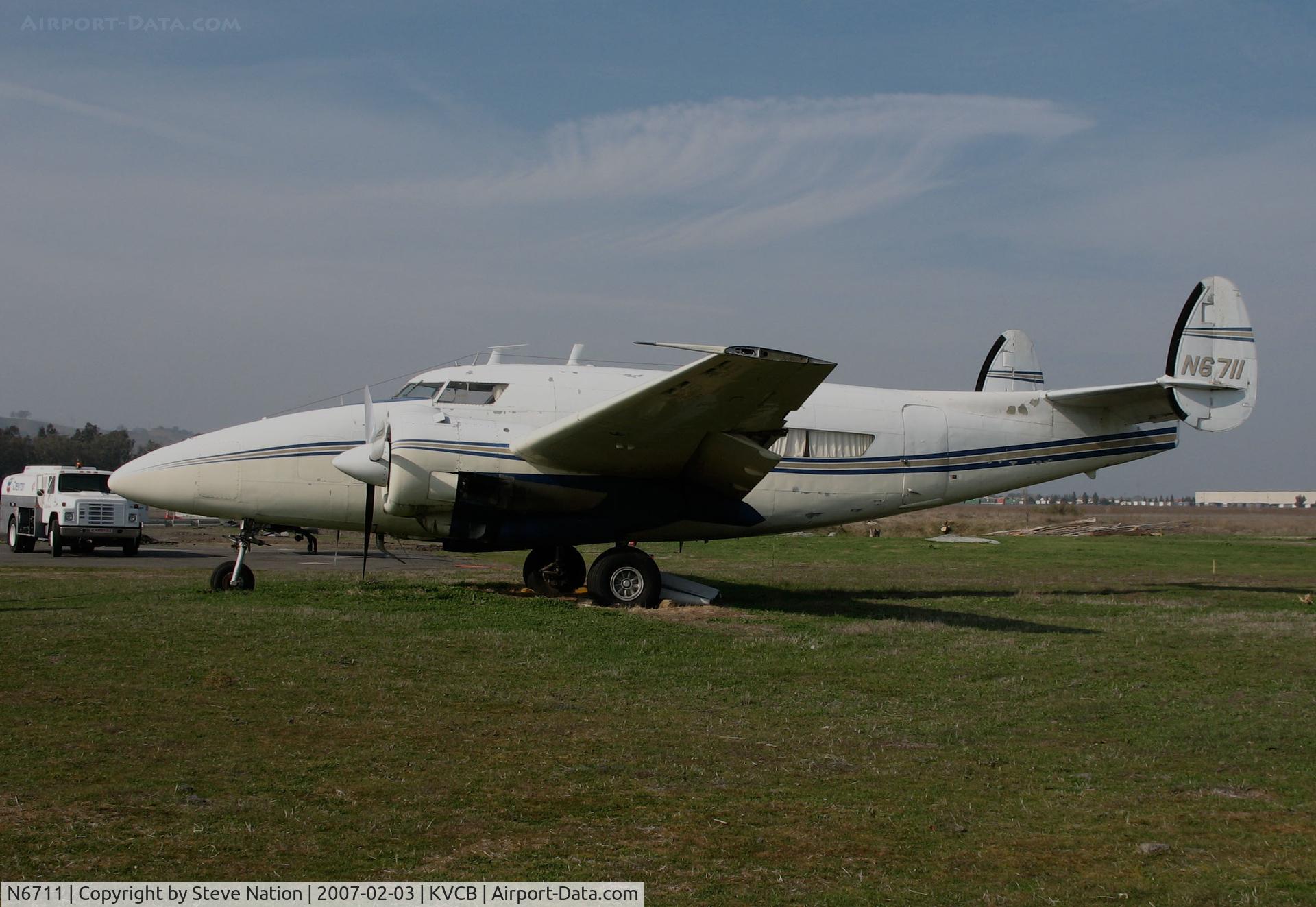 N6711, 1966 Lockheed 18 Lodestar C/N 2484, Locally-based Howard 500 (nose gear, souped up 1966 Lockheed L-18 conversion) @ Nut Tree Airport, Vacaville, CA