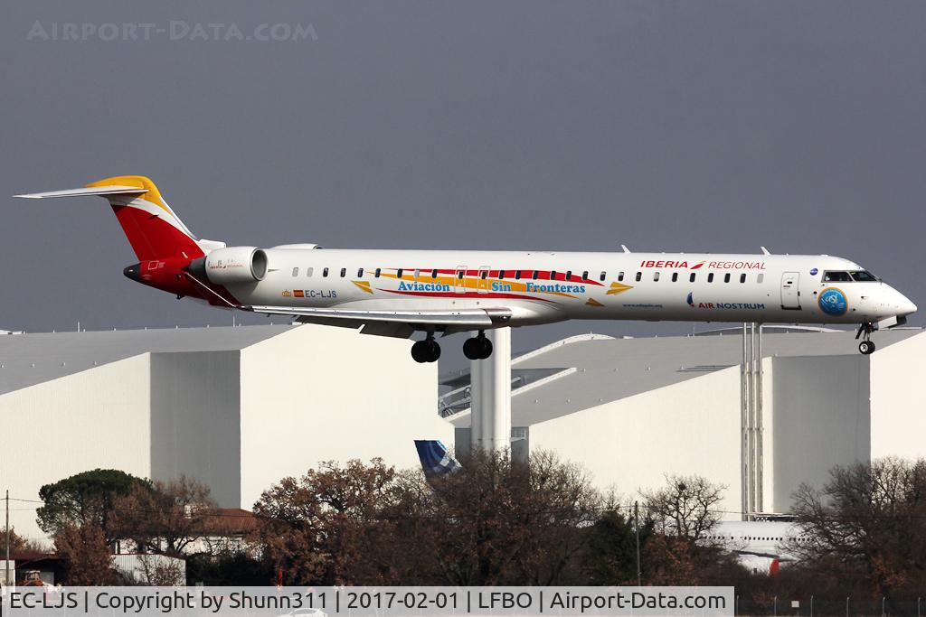 EC-LJS, 2010 Bombardier CRJ-1000ER NG (CL-600-2E25) C/N 19003, Landing rwy 14R in special 'Aviacion sin fronteras' c/s