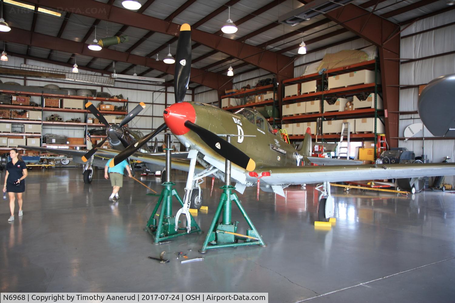 N6968, 1943 Bell P-39Q Airacobra C/N 219597, Up on jacks getting its nose wheel serviced.  Look carefully at where jack points are on this 1943 Bell P-39Q Airacobra, c/n: 219597