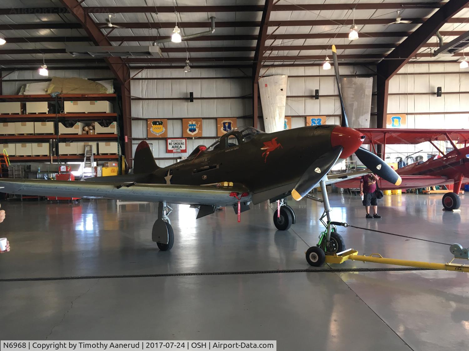 N6968, 1943 Bell P-39Q Airacobra C/N 219597, Getting towed out of the hangar after it's nose wheel was serviced. 1943 Bell P-39Q Airacobra, c/n: 219597